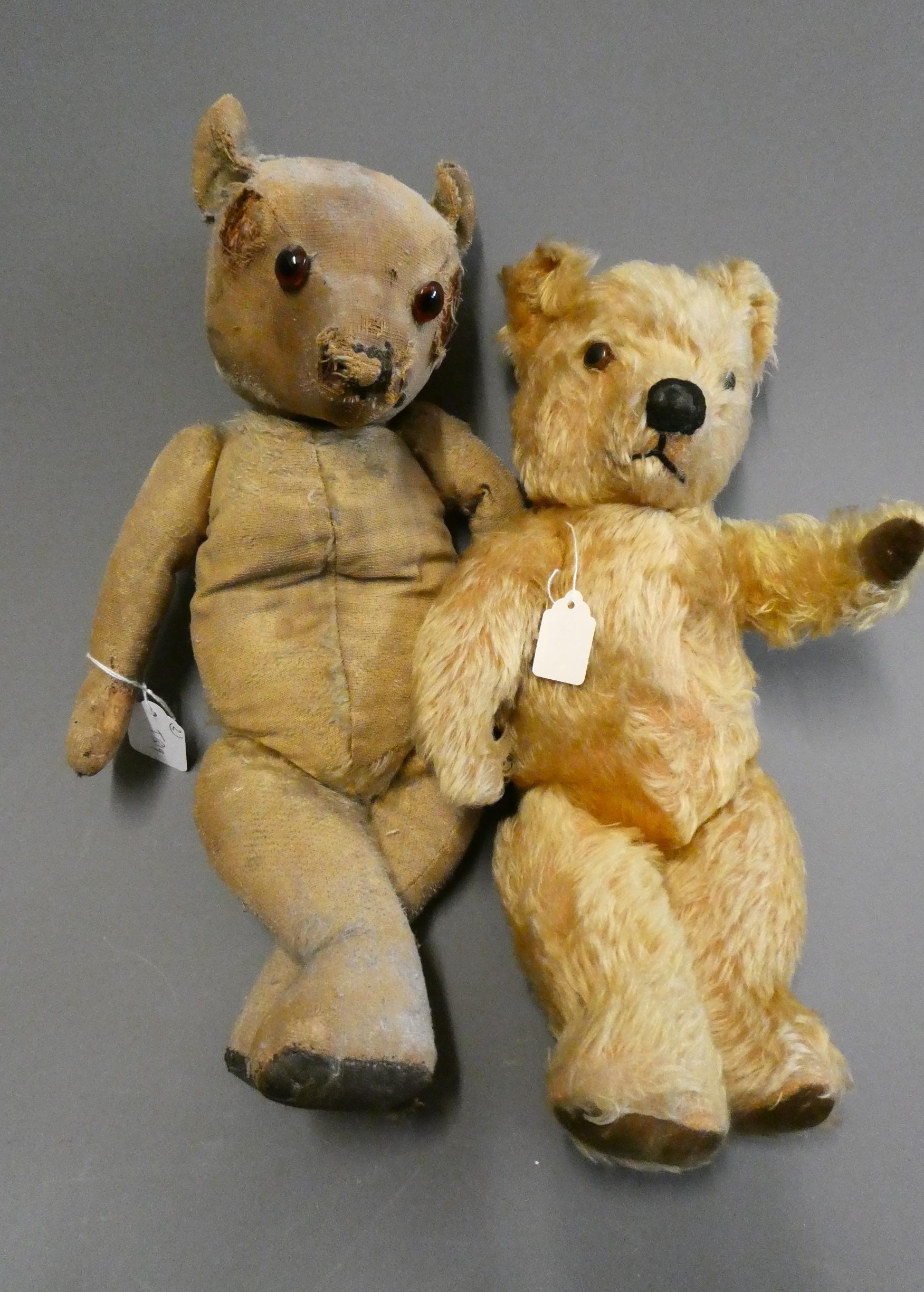 Two old teddy bears, including a 17" bear with amber glass eyes, leather pads and hump to back, and Image