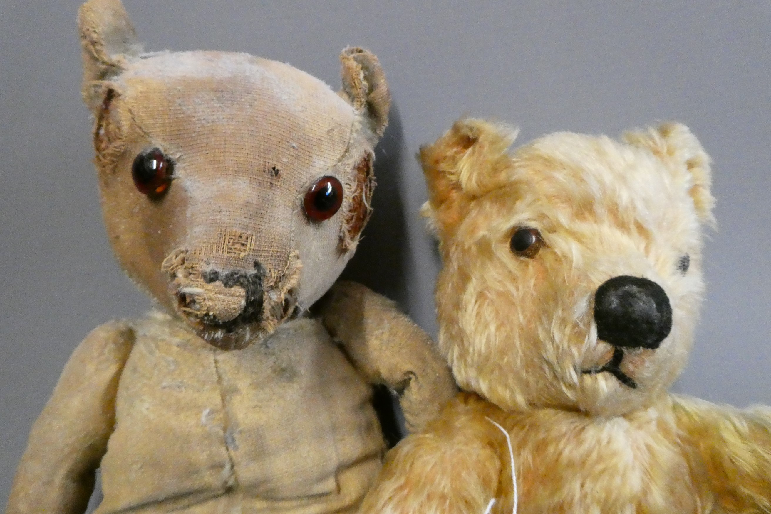 Two old teddy bears, including a 17" bear with amber glass eyes, leather pads and hump to back, and Image