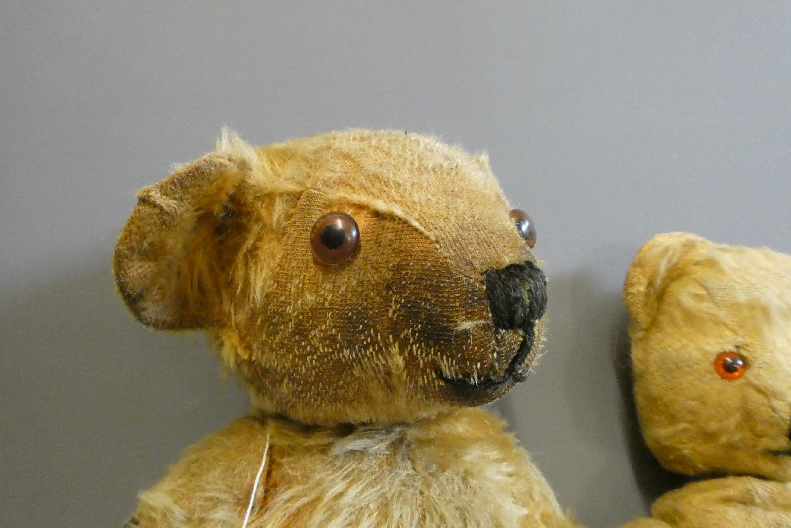 Two vintage teddy bears, one 17 1/2" long with hump to back and remnants of label to foot, the other Image