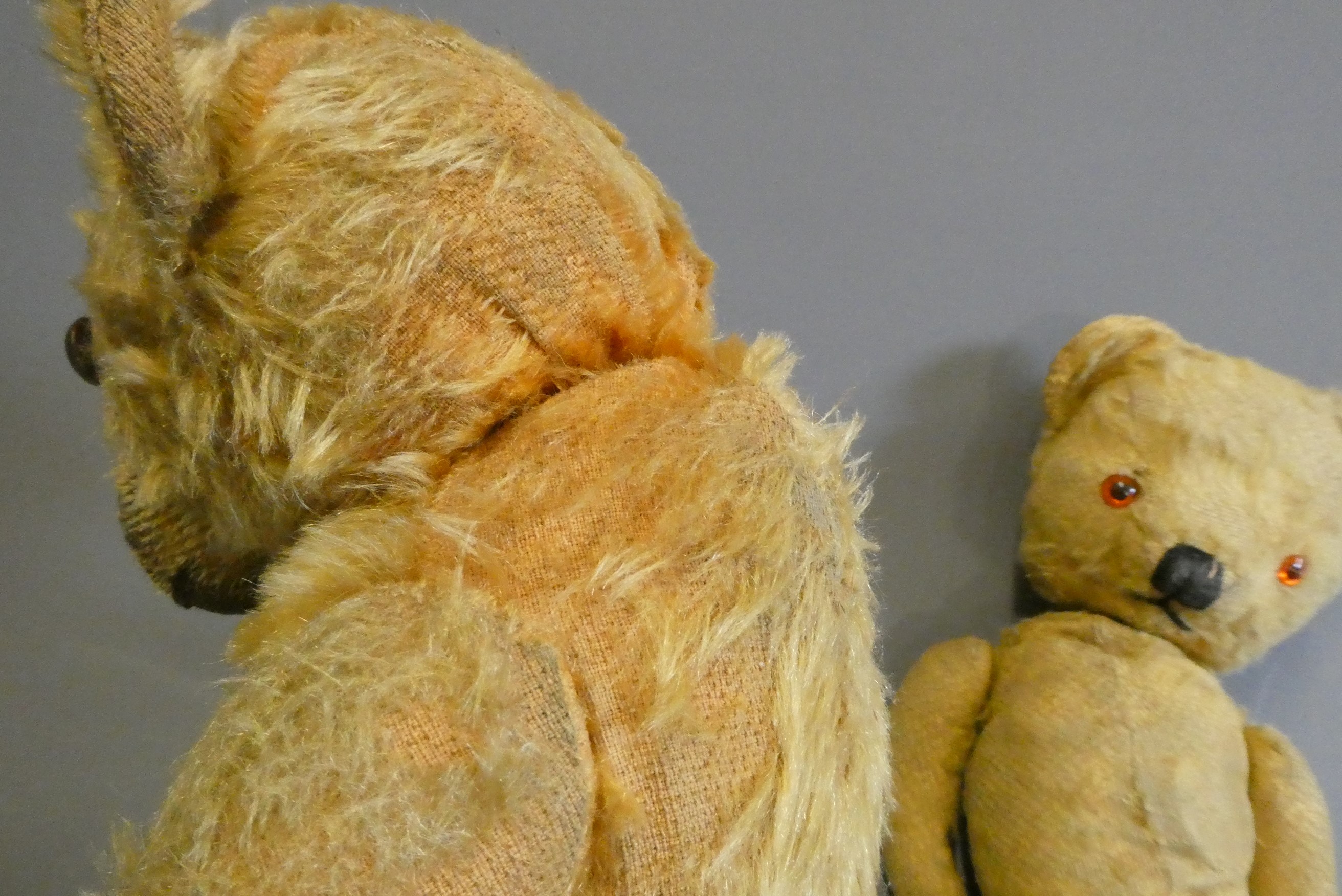 Two vintage teddy bears, one 17 1/2" long with hump to back and remnants of label to foot, the other Image