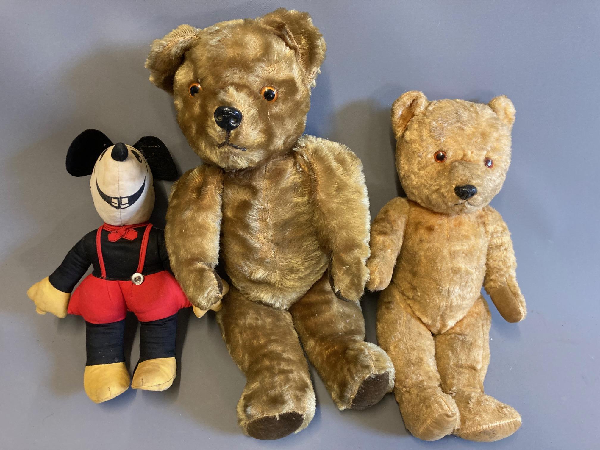 Three vintage soft toys, comprising two teddy bears with plastic noses and jointed bodies, together Image
