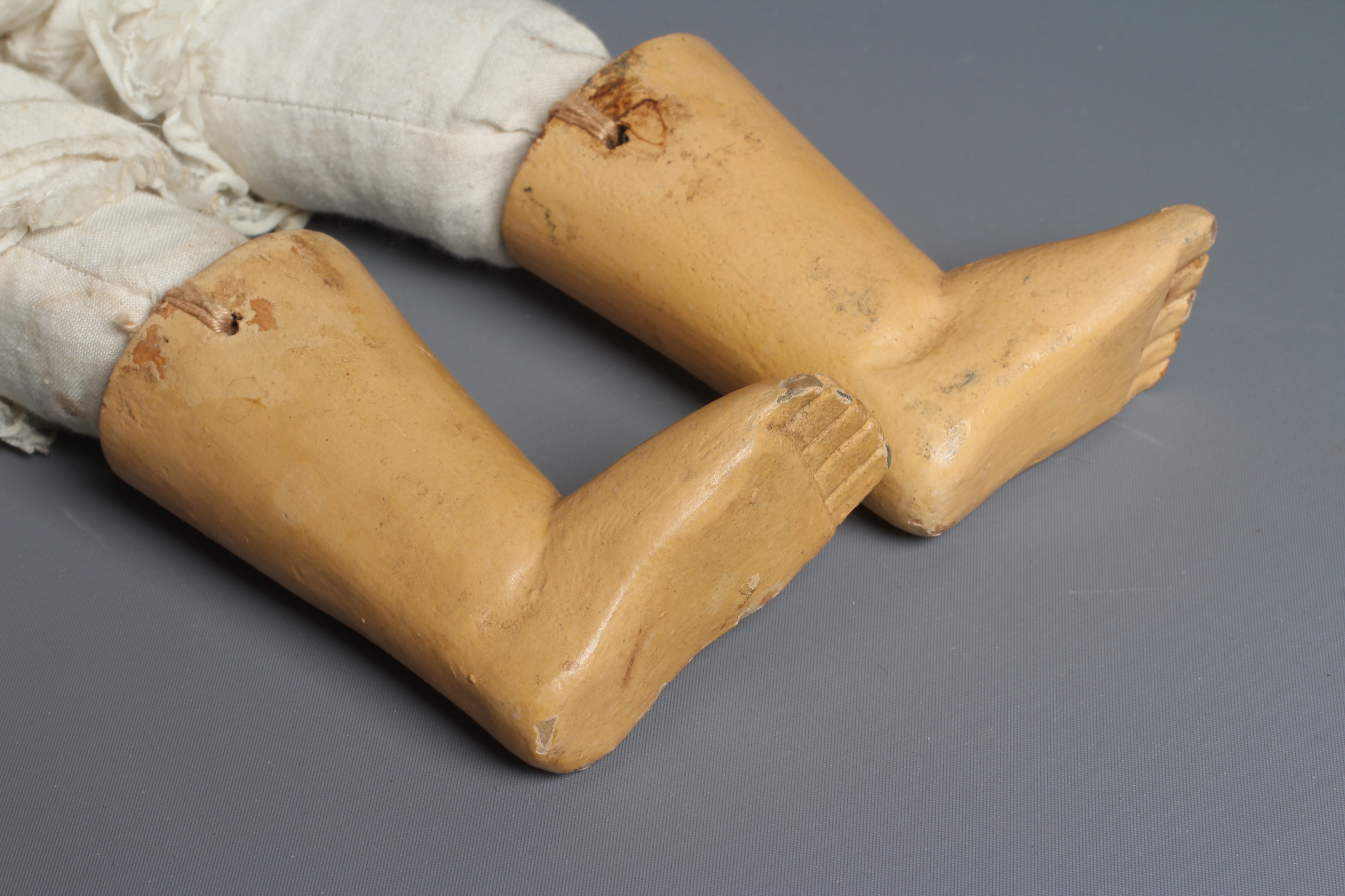 A folk art male doll, possibly a Santos doll, with carved wood and plaster head, painted features, Image