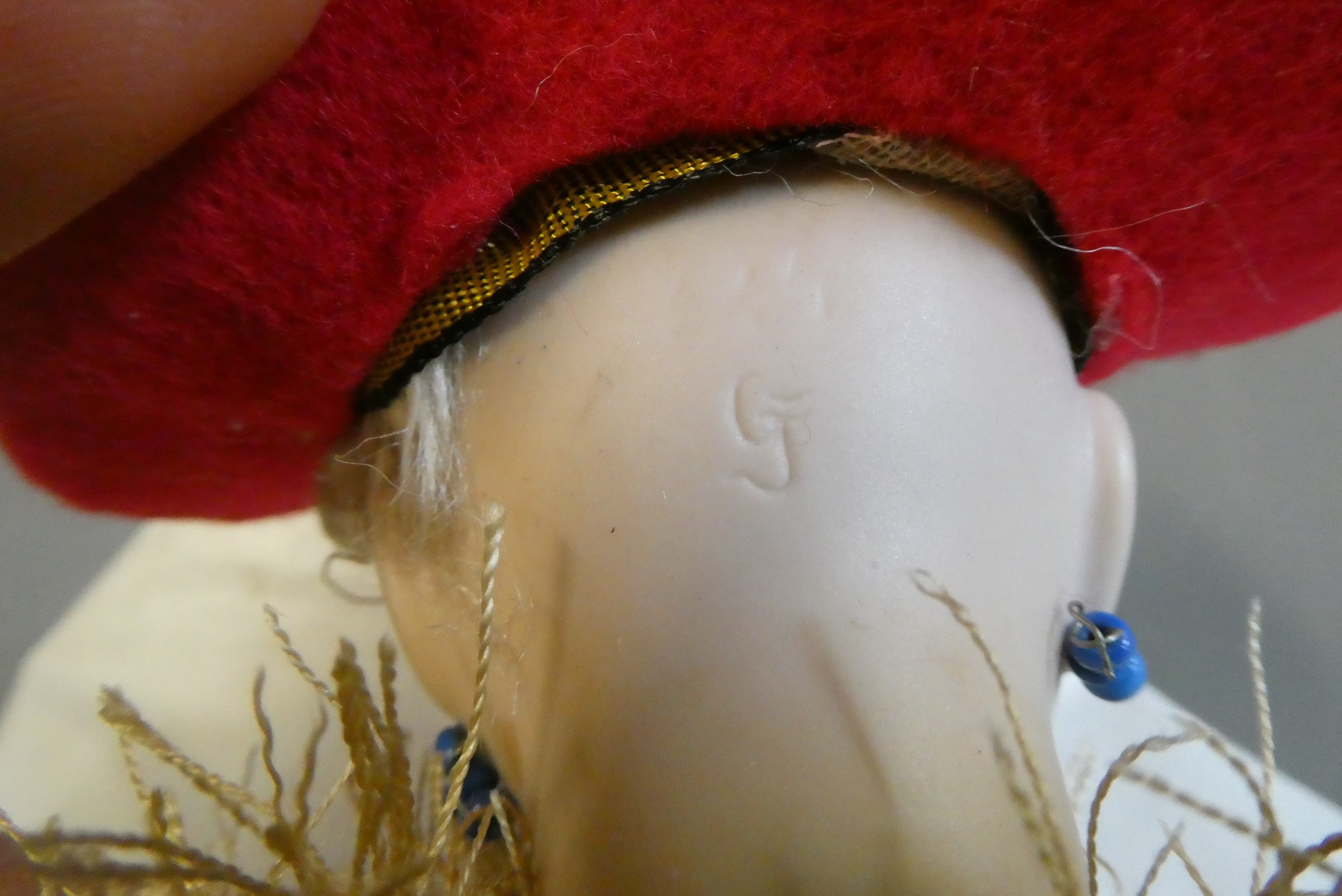 A bisque head acrobat doll, with brown glass fixed eyes, mouth moulded open with teeth, pierced Image