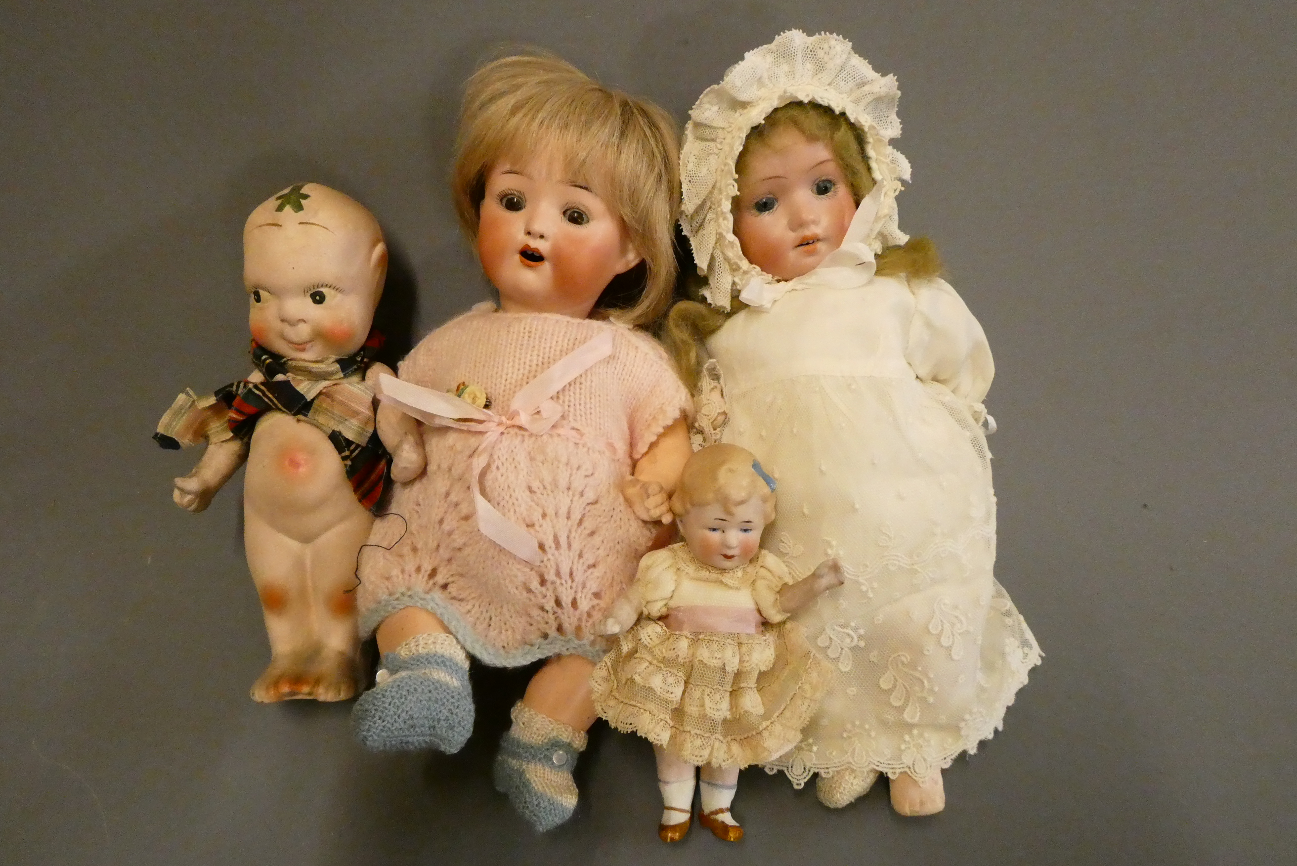 Four bisque head dolls Image