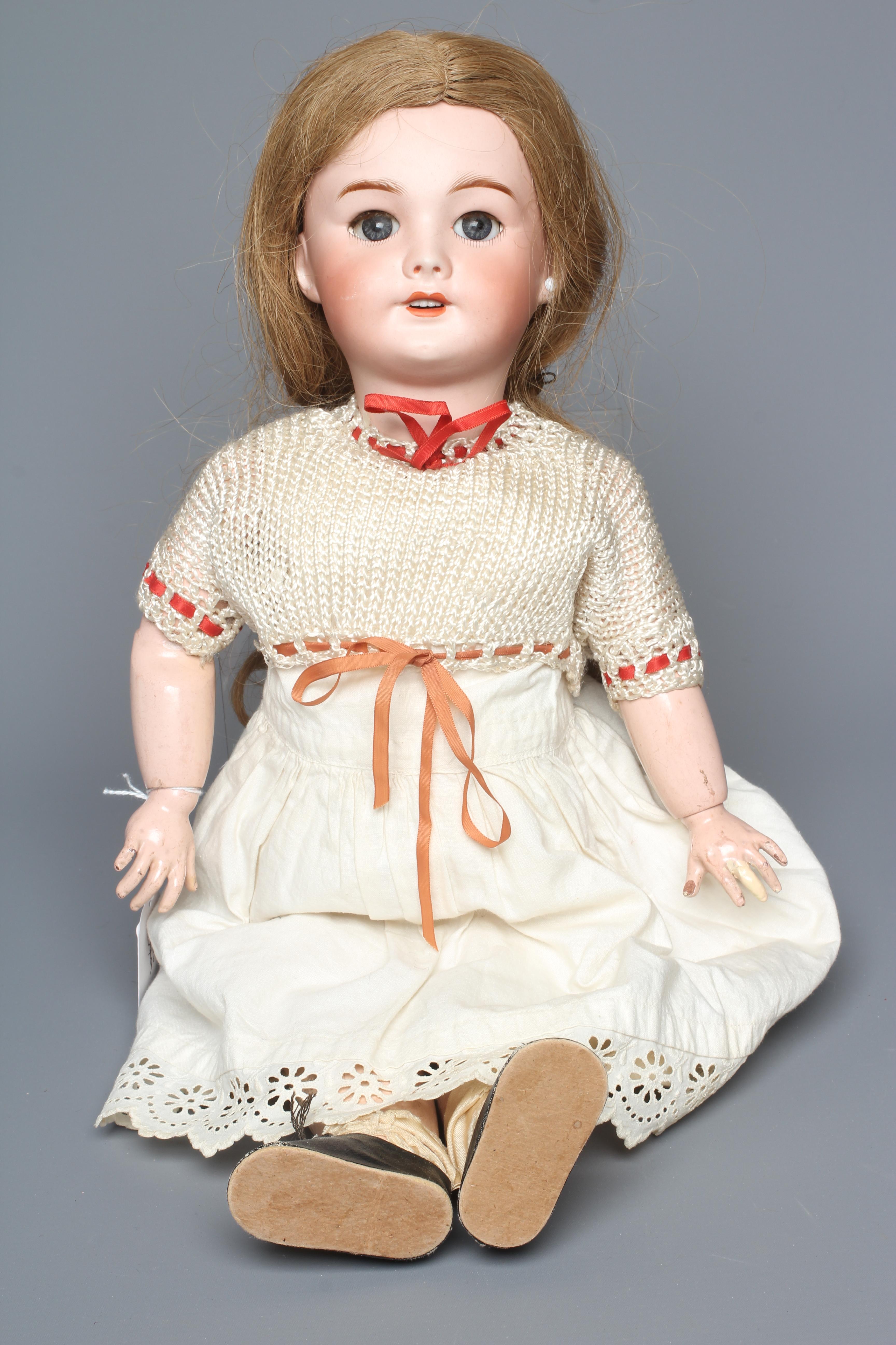 An SFBJ bisque socket head doll, with blue glass sleeping eyes, open mouth, teeth, pierced ears, Image