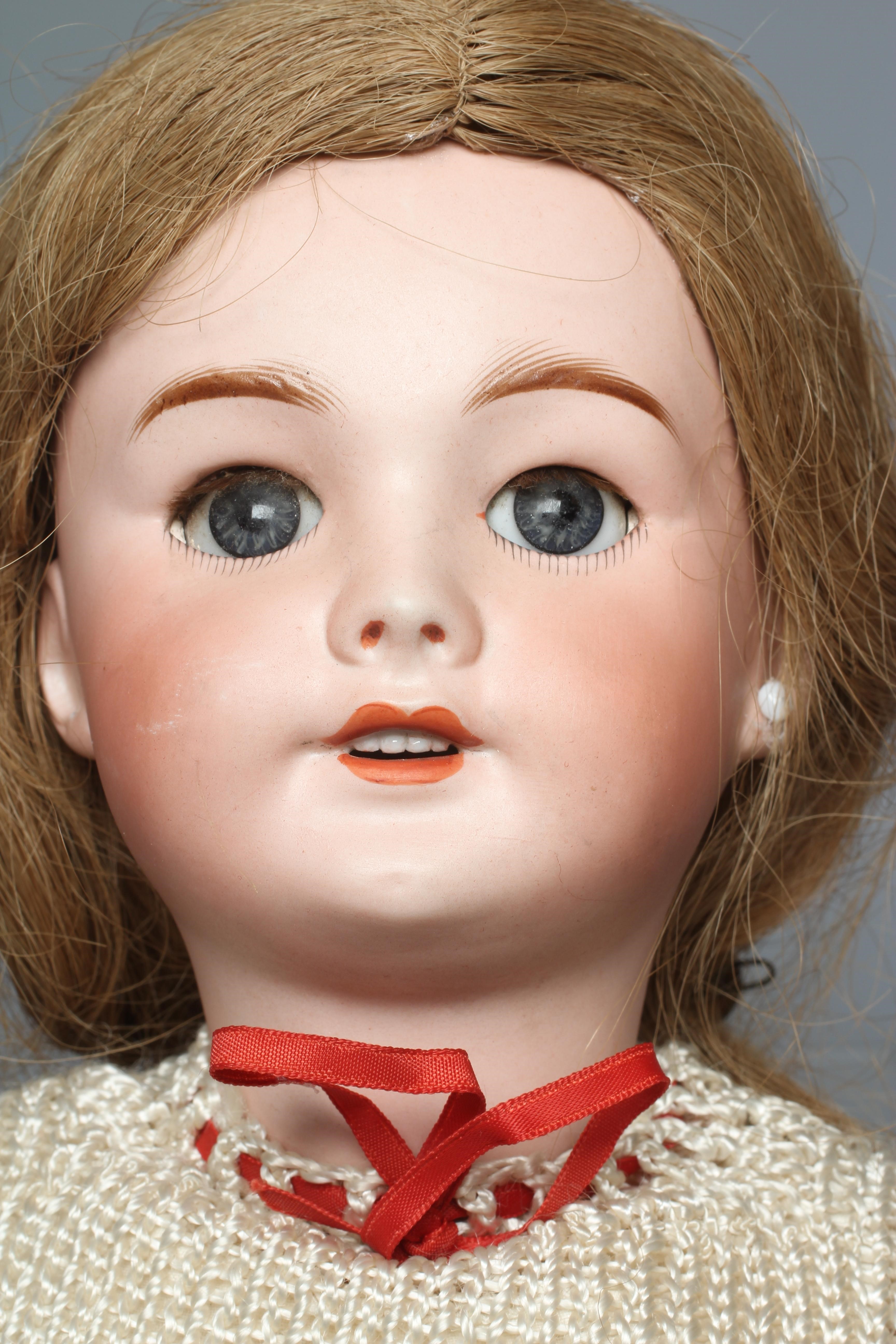 An SFBJ bisque socket head doll, with blue glass sleeping eyes, open mouth, teeth, pierced ears, Image