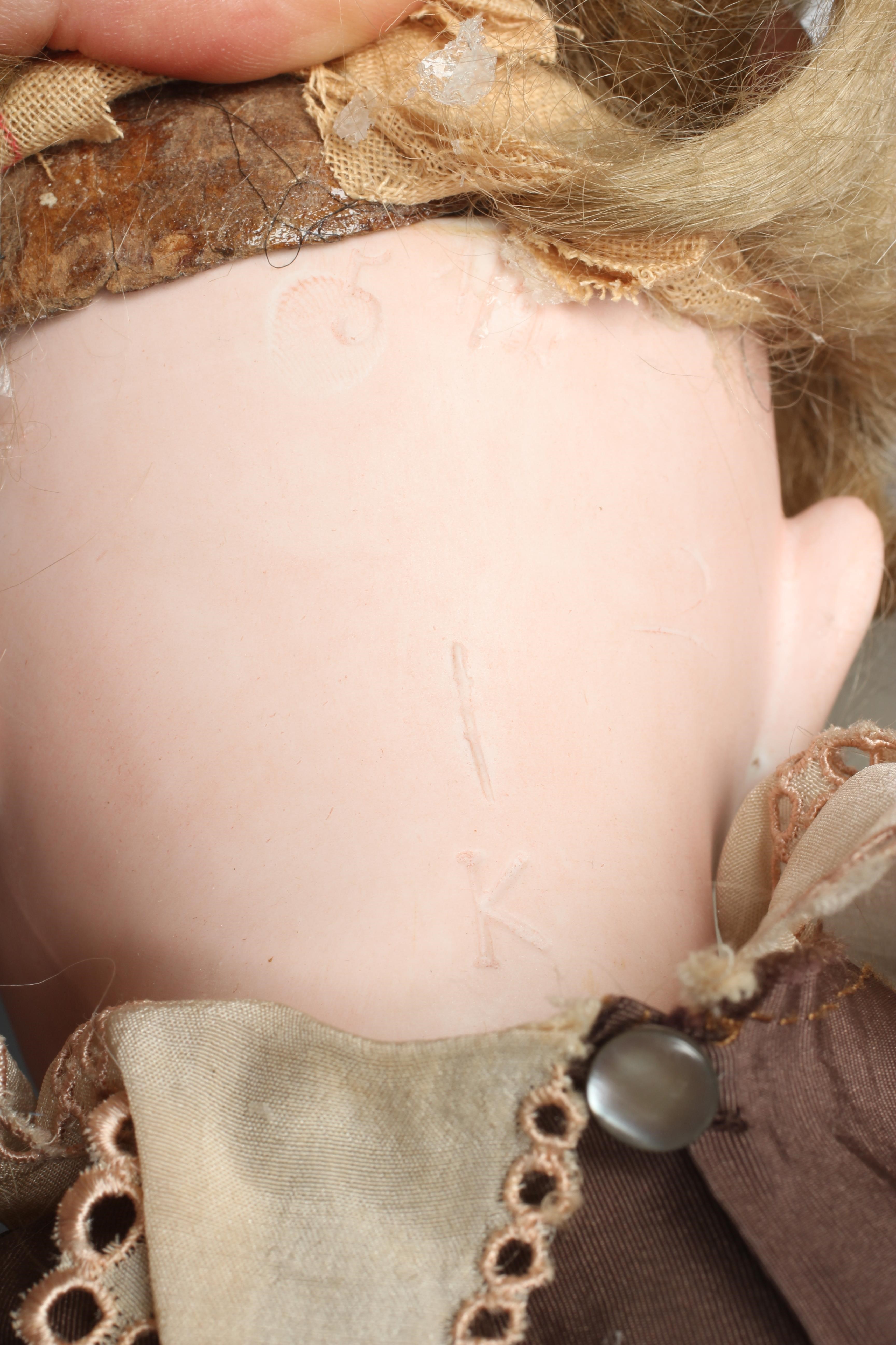 A bisque socket head doll, with blue glass fixed eyes, open mouth, teeth, pierced ears, blond wig, Image