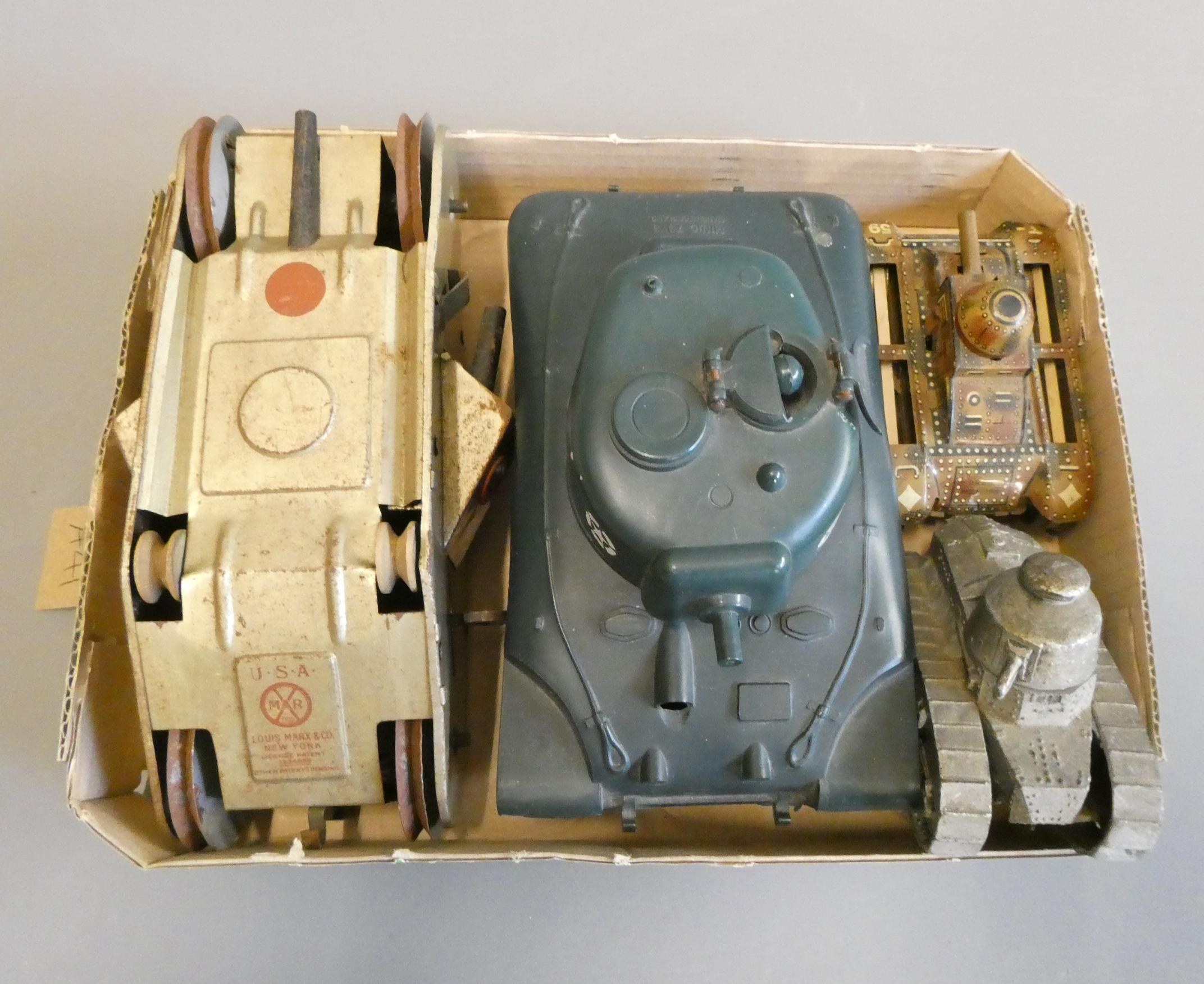 Four army tanks comprising triang clockwork tank (missing gun barrel ...