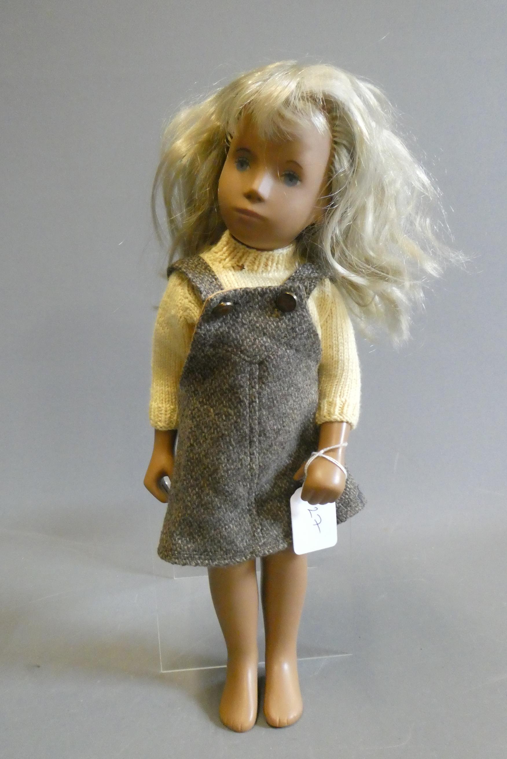 Sasha girl doll, with blond hair and jointed body, 16" long, with some spare clothing Image