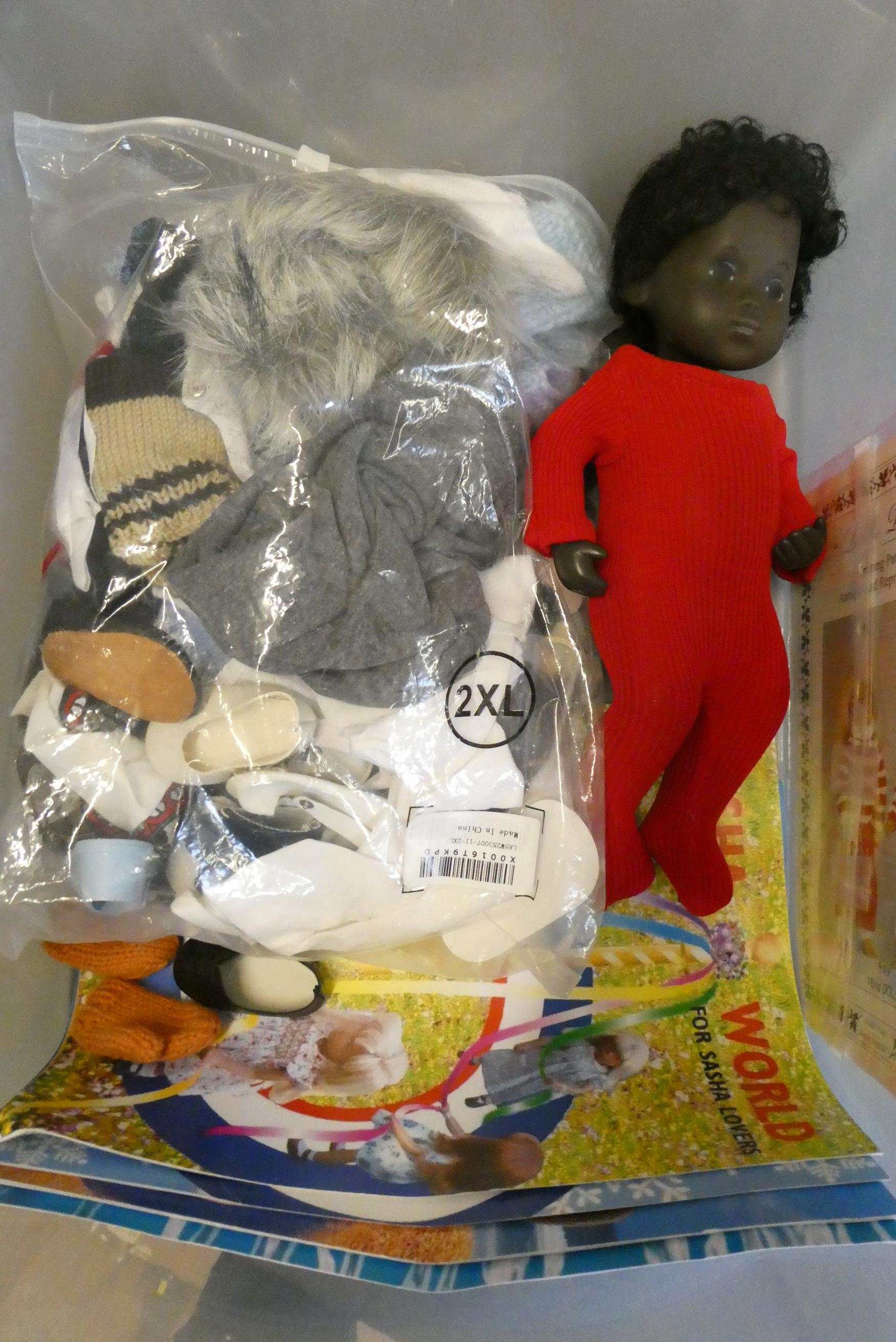 Sasha baby doll, with black curly hair and jointed body, together with Sasha clothing, four Sasha Image