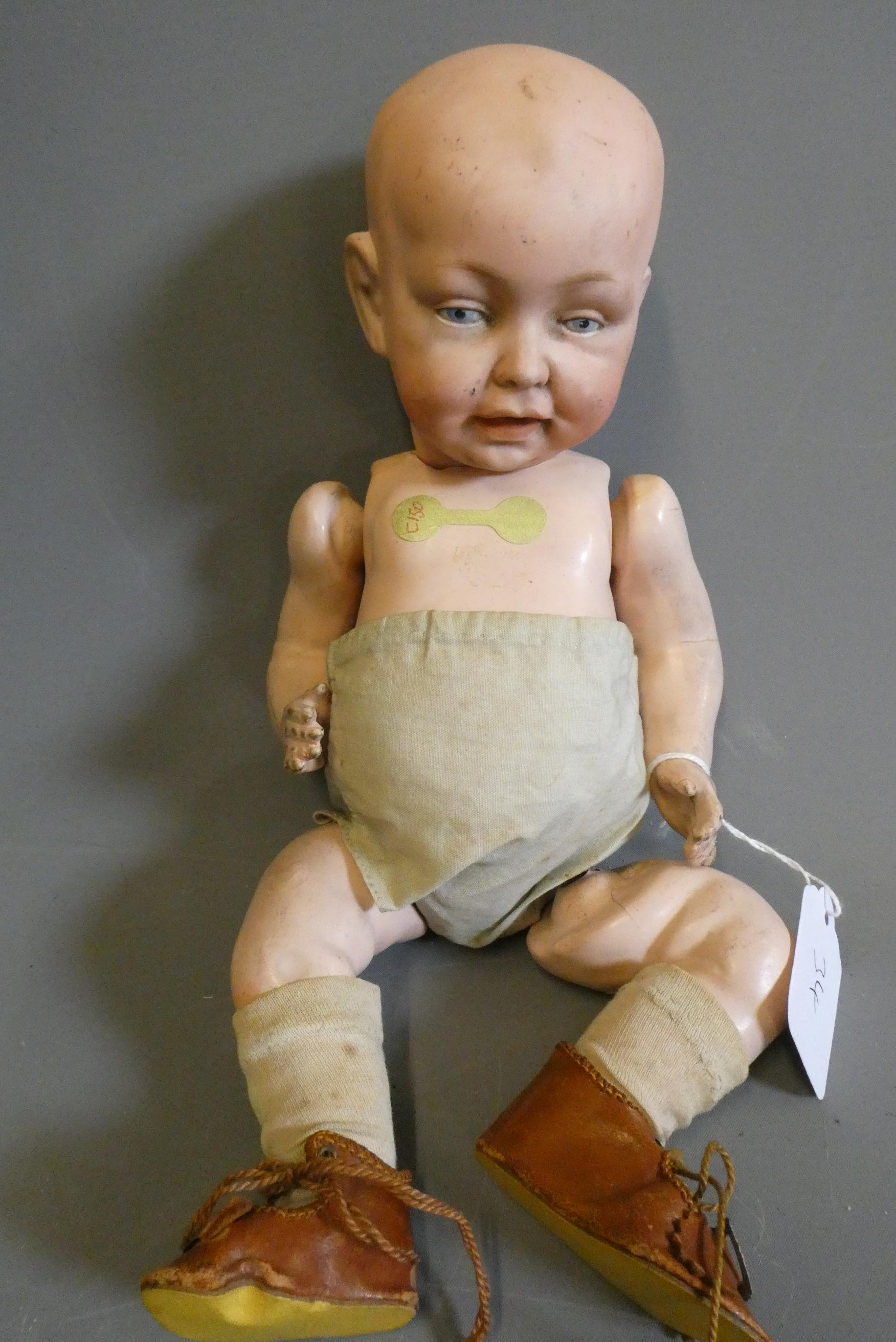 A character boy bisque socket head doll, possibly Kestner, with painted eyes, moulded open mouth, Image