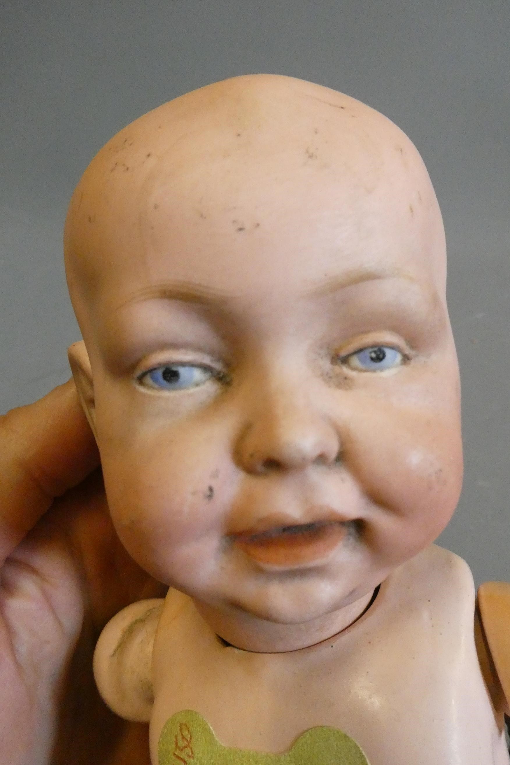 A character boy bisque socket head doll, possibly Kestner, with painted eyes, moulded open mouth, Image