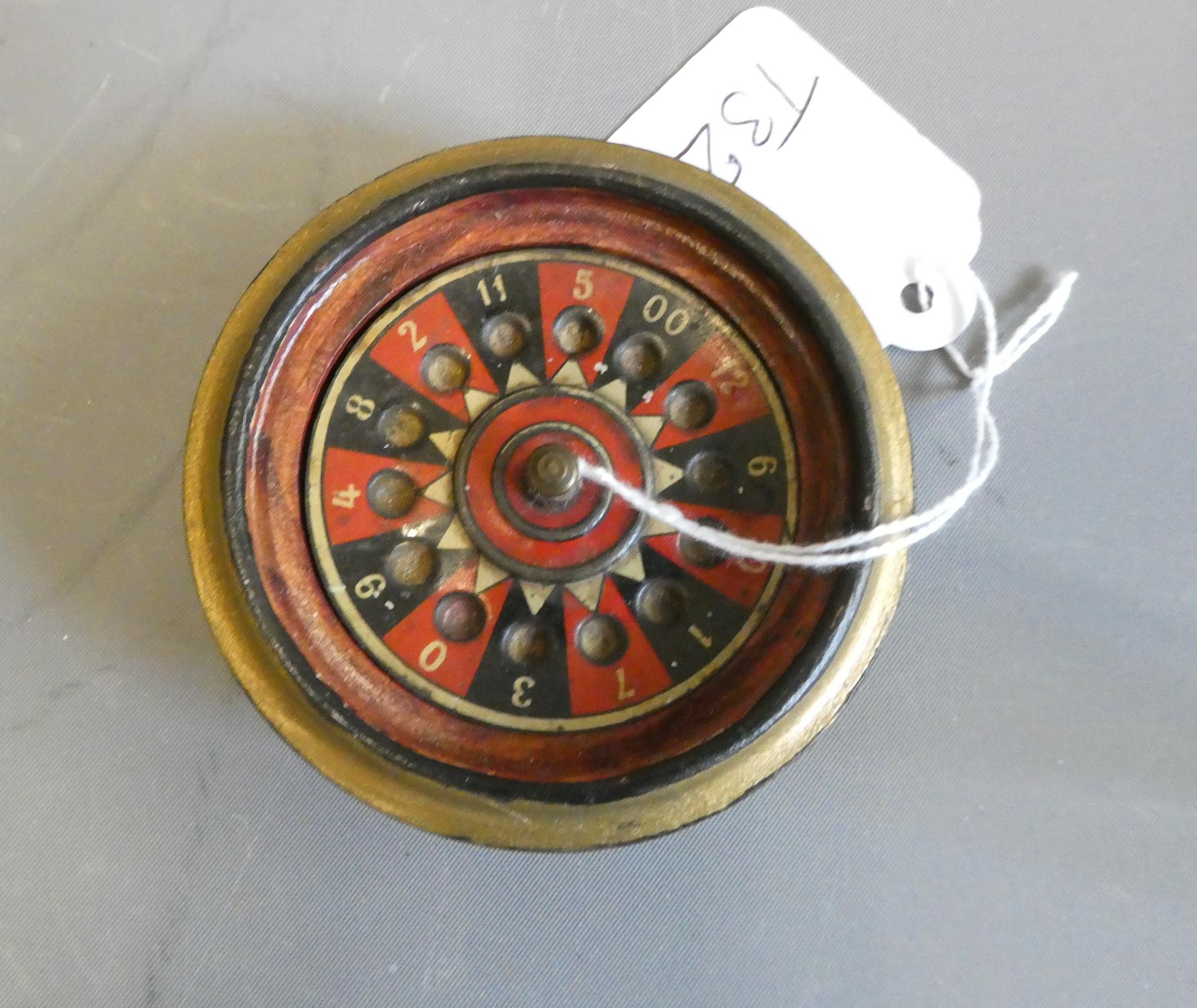 Early 20th century miniature roulette wheel, hand painted wooden base ...