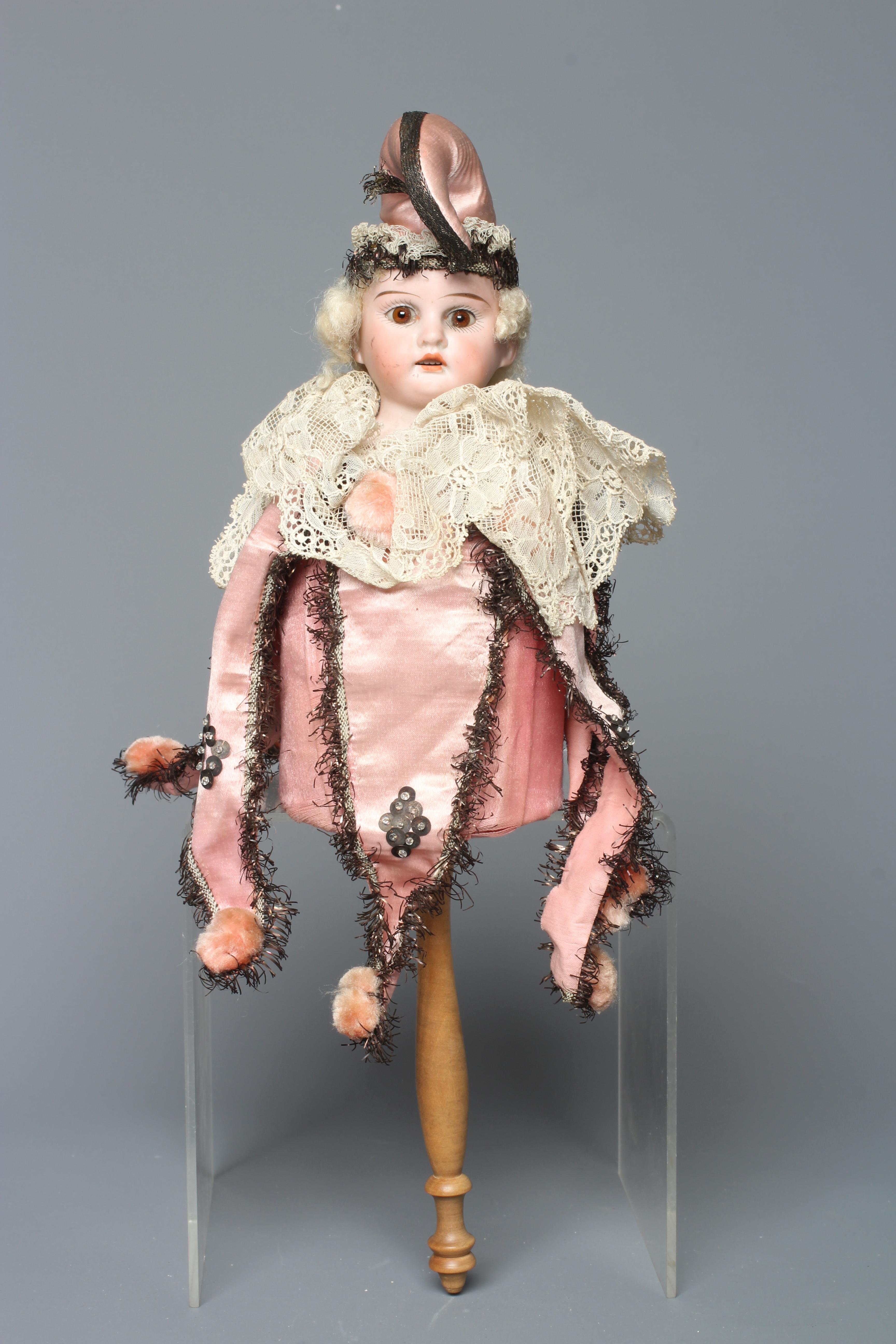 An Armand Marseille bisque shoulder head Marotte doll, with brown glass fixed eyes, open mouth Image