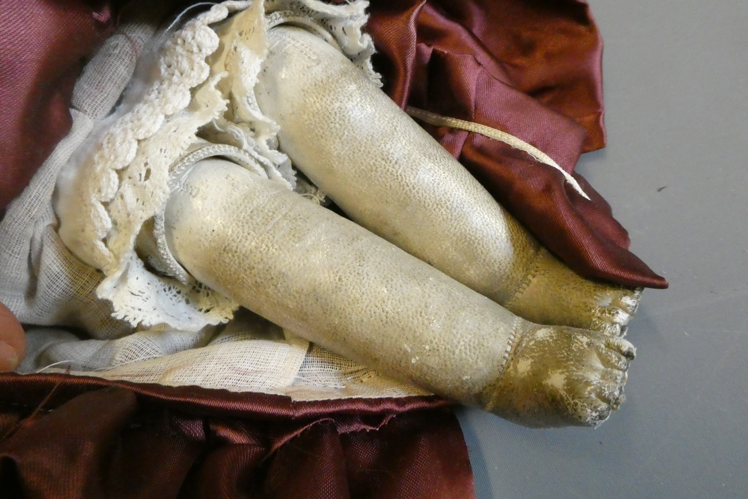 A bisque shoulder head doll, with blue glass sleeping eyes, open mouth, teeth, kid body with jointed Image