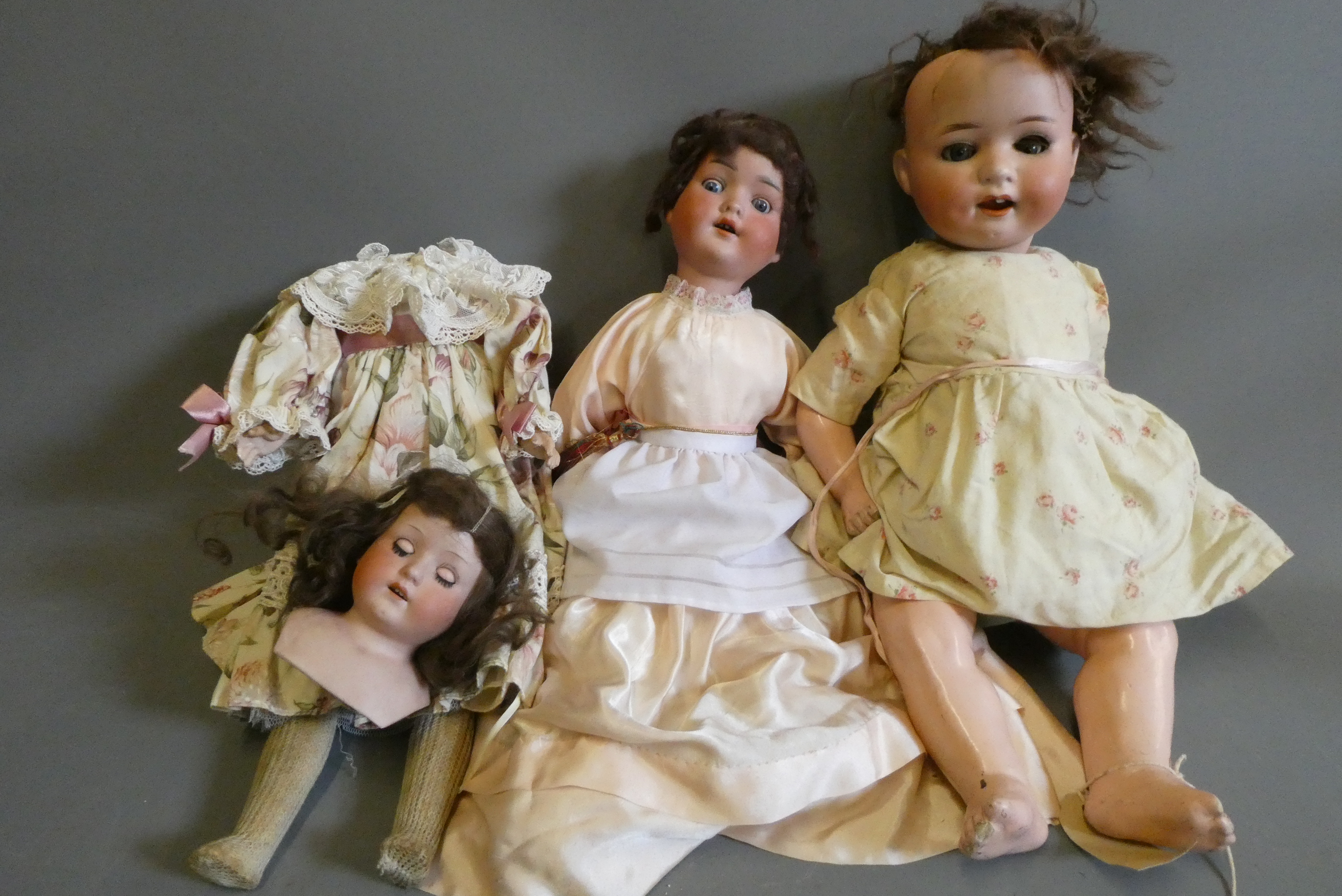 Three bisque head dolls Image