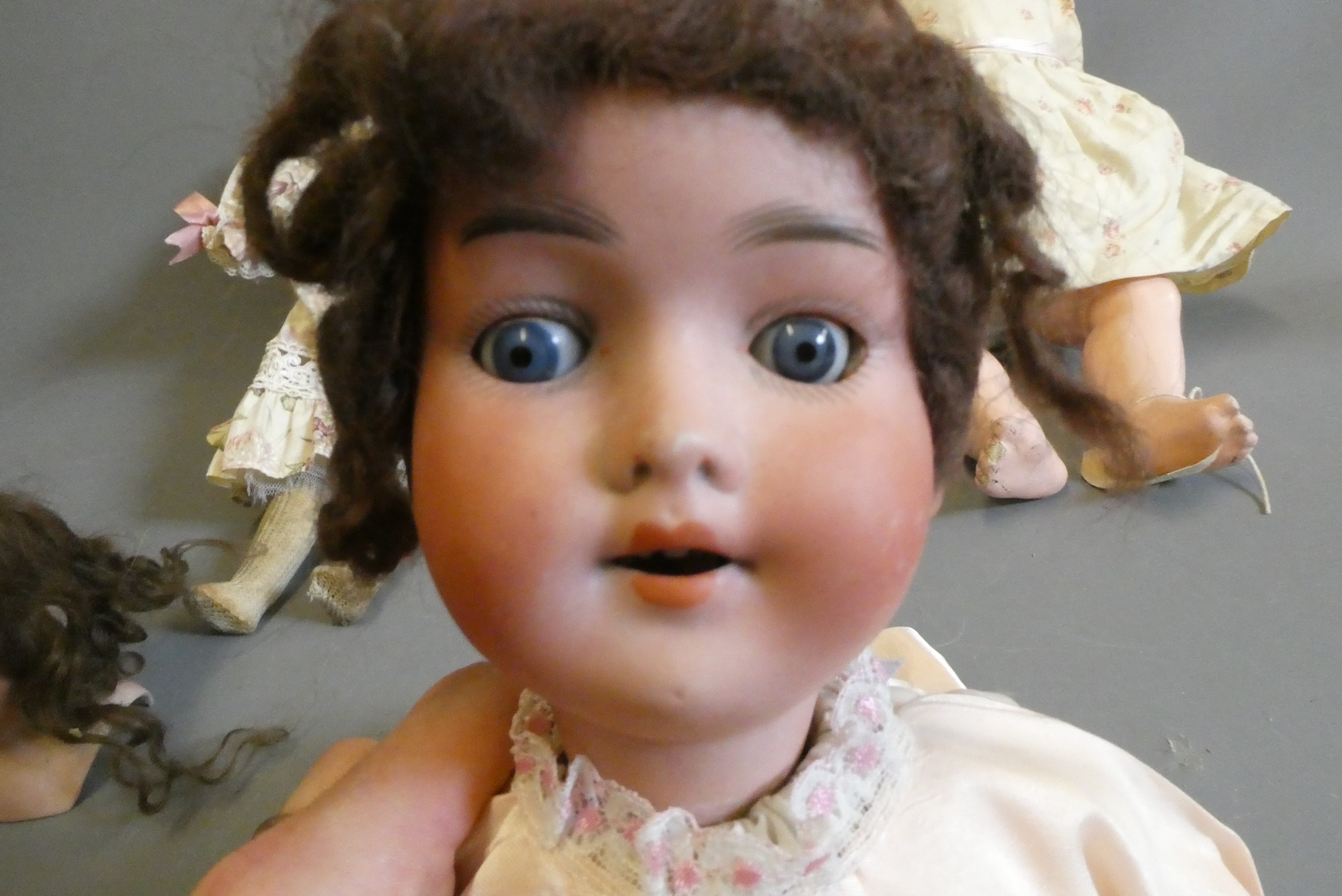 Three bisque head dolls Image