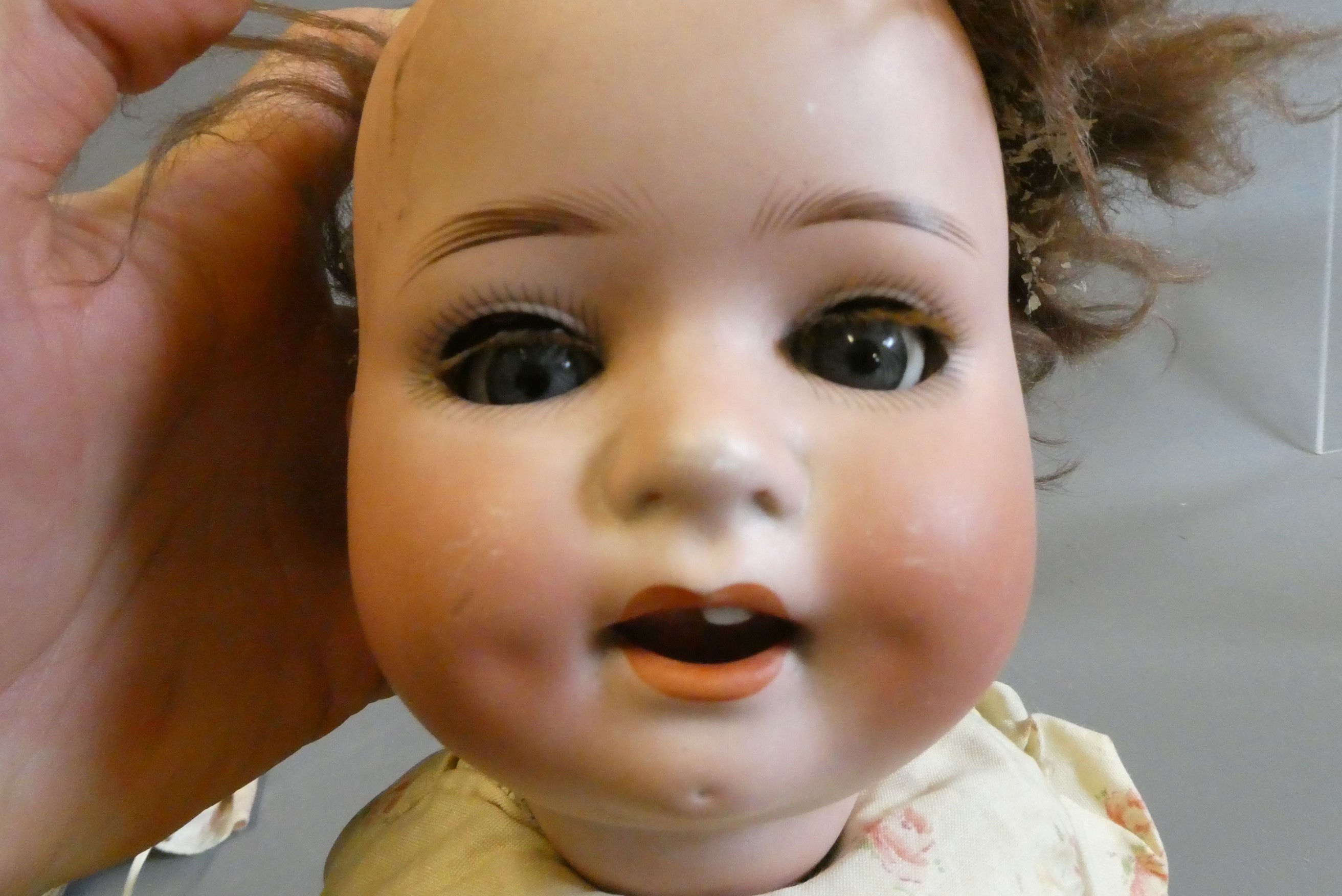 Three bisque head dolls Image