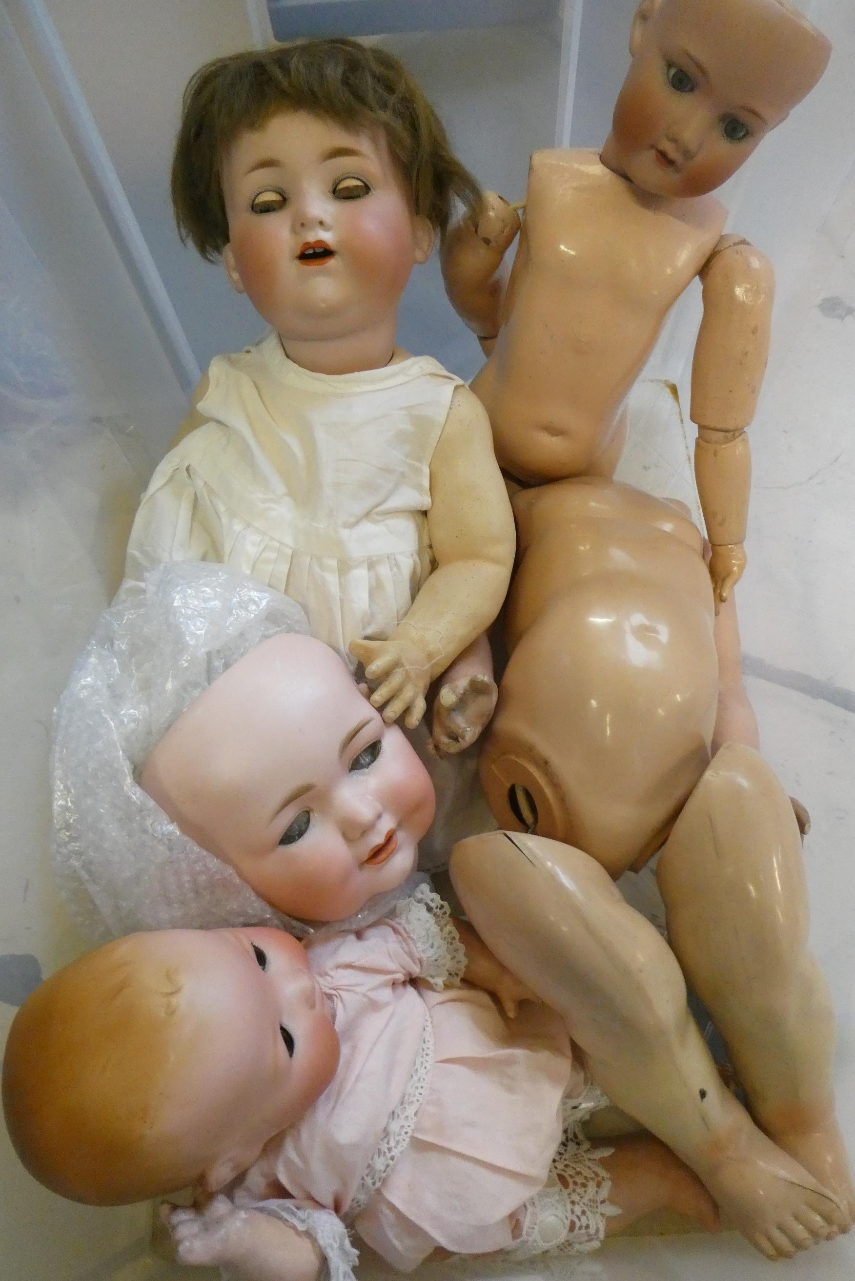 Four Armand Marseille bisque head dolls Image