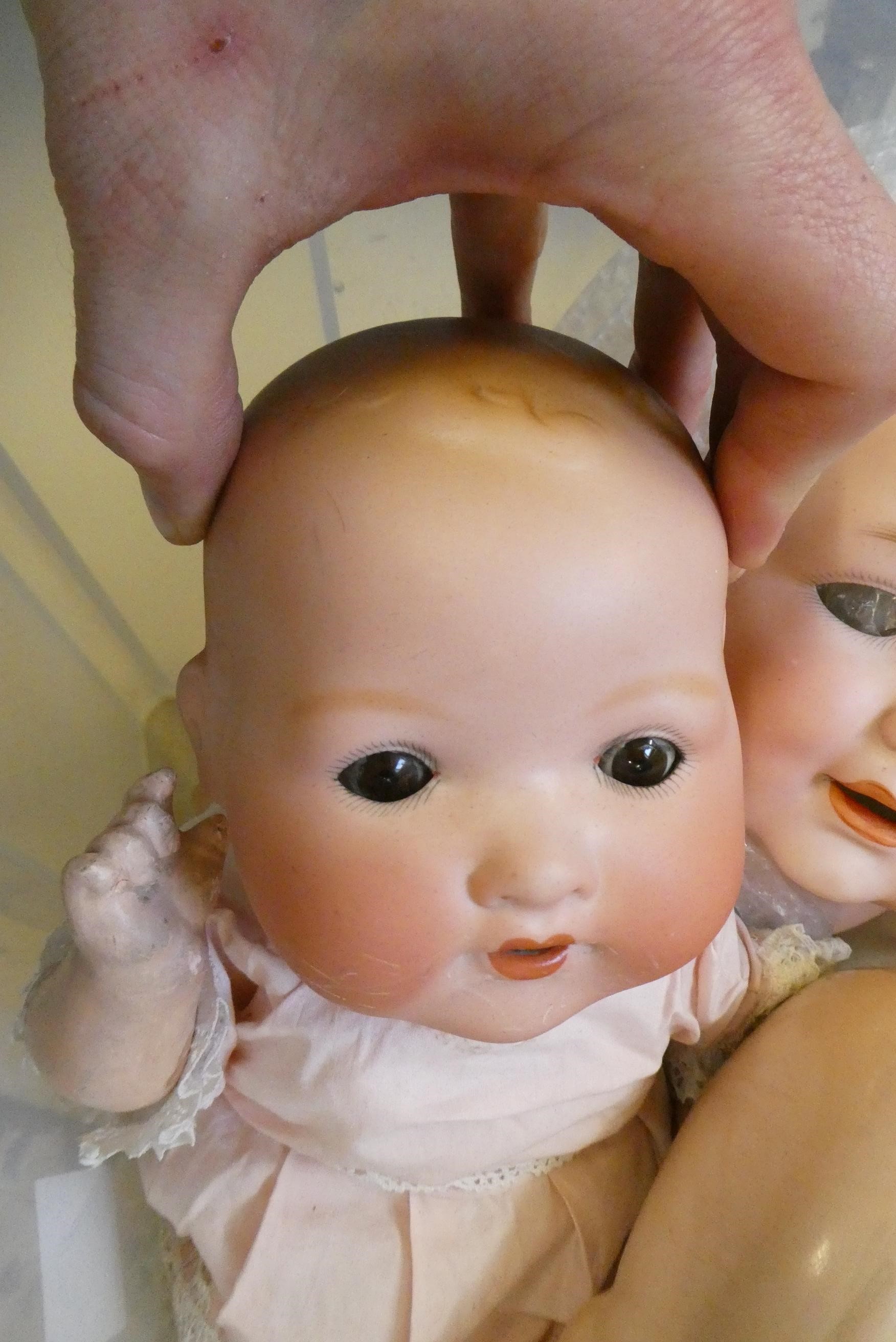Four Armand Marseille bisque head dolls Image