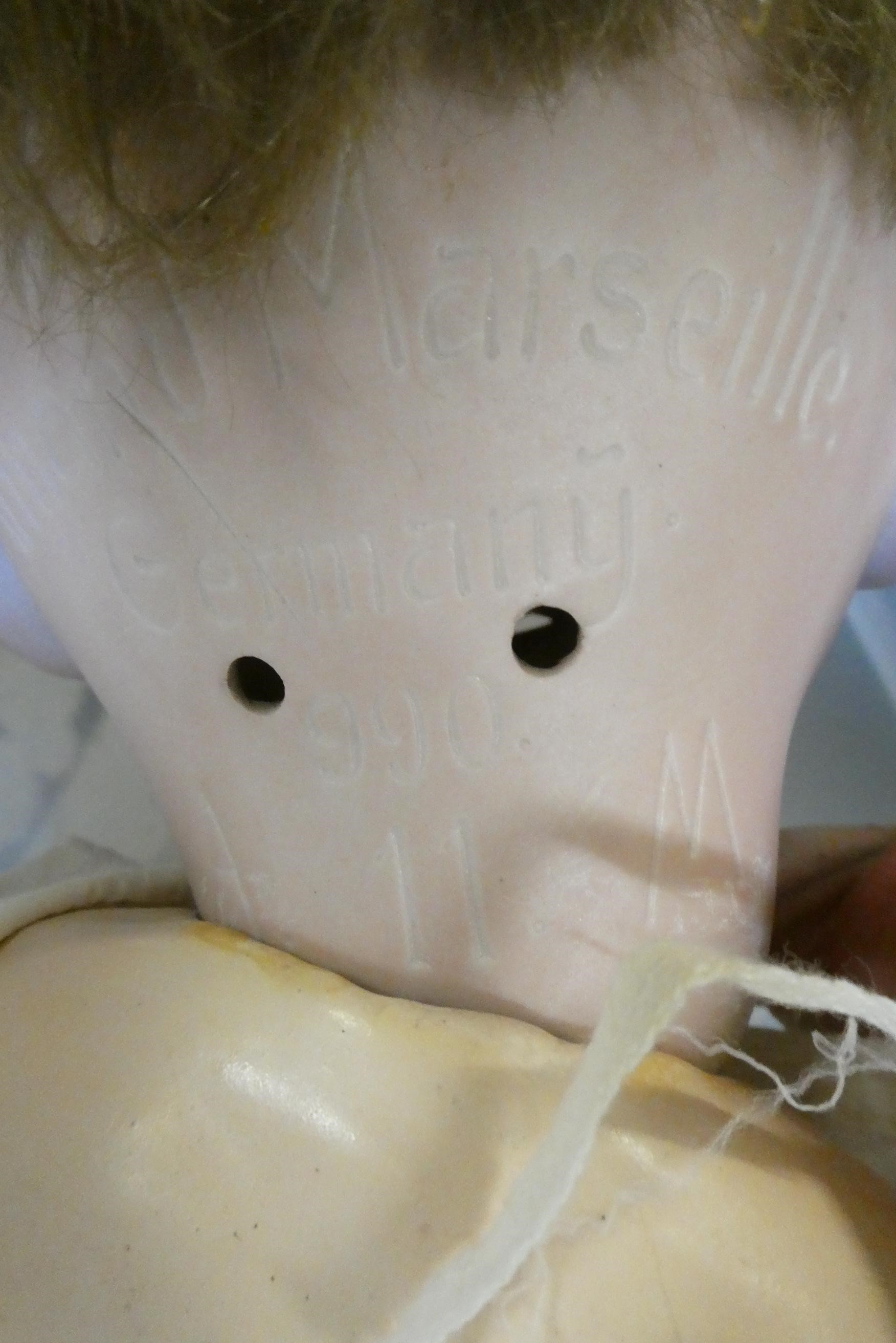 Four Armand Marseille bisque head dolls Image