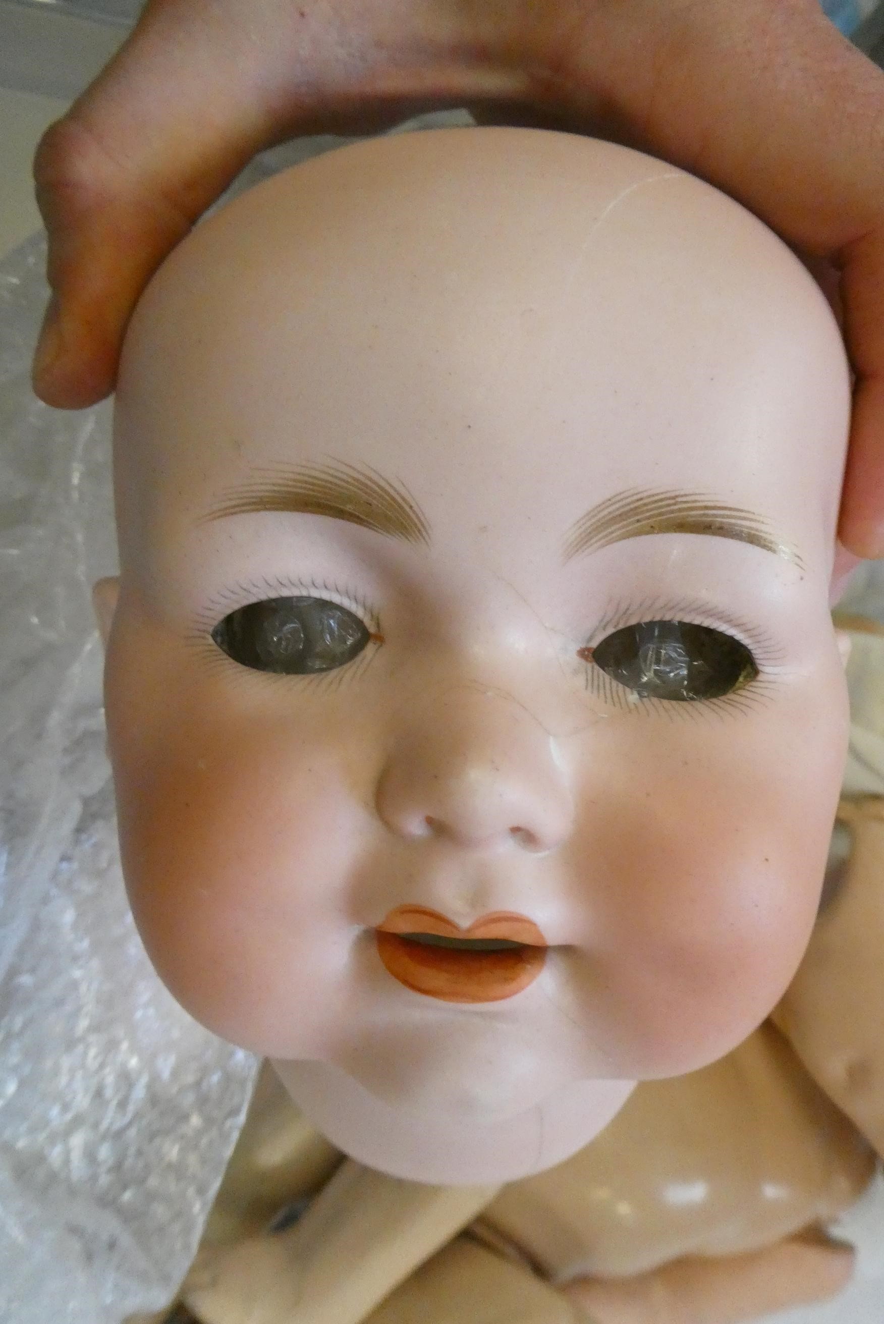 Four Armand Marseille bisque head dolls Image