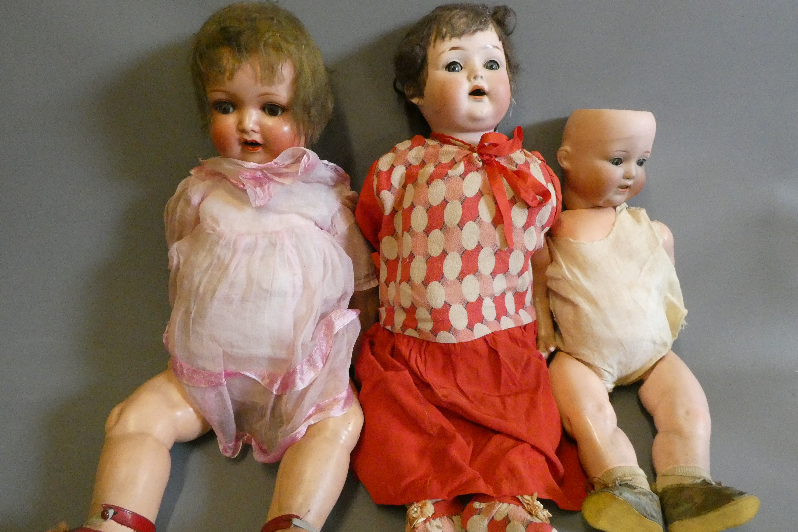 Three bisque socket head dolls Image