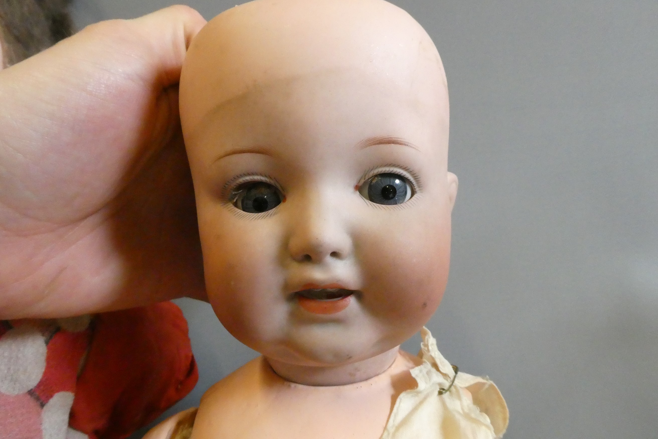 Three bisque socket head dolls Image