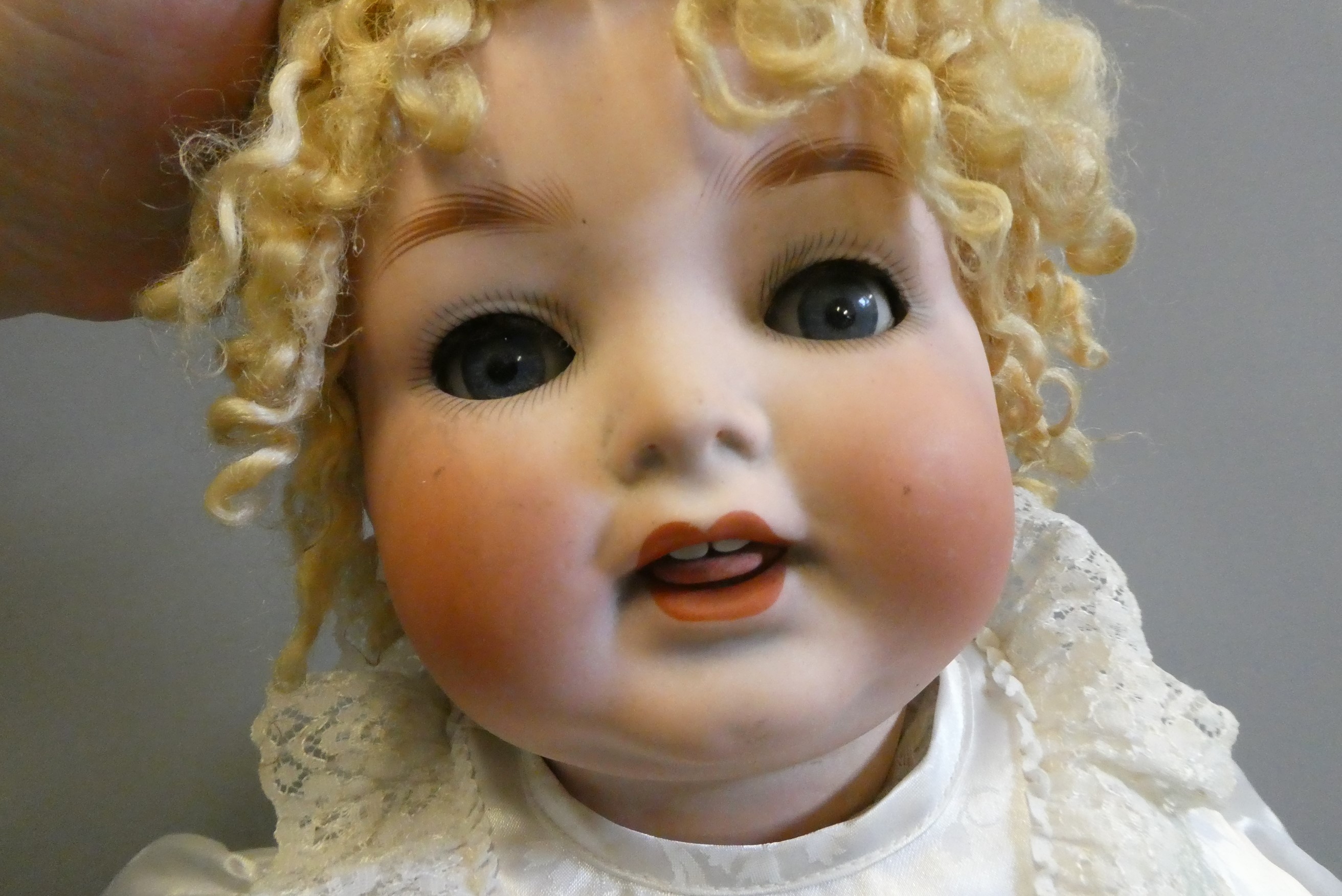 A Heubach Koppelsdorf bisque socket head character doll, with blue glass sleeping eyes, open mouth, Image