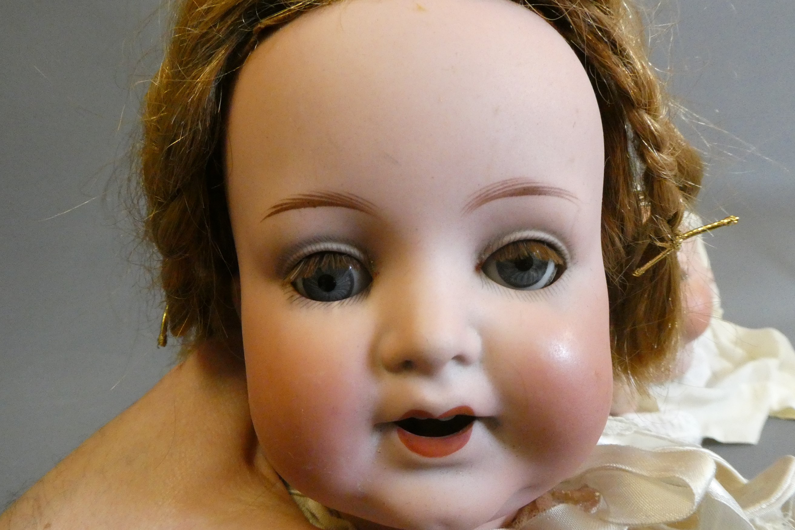 Four bisque socket head dolls Image