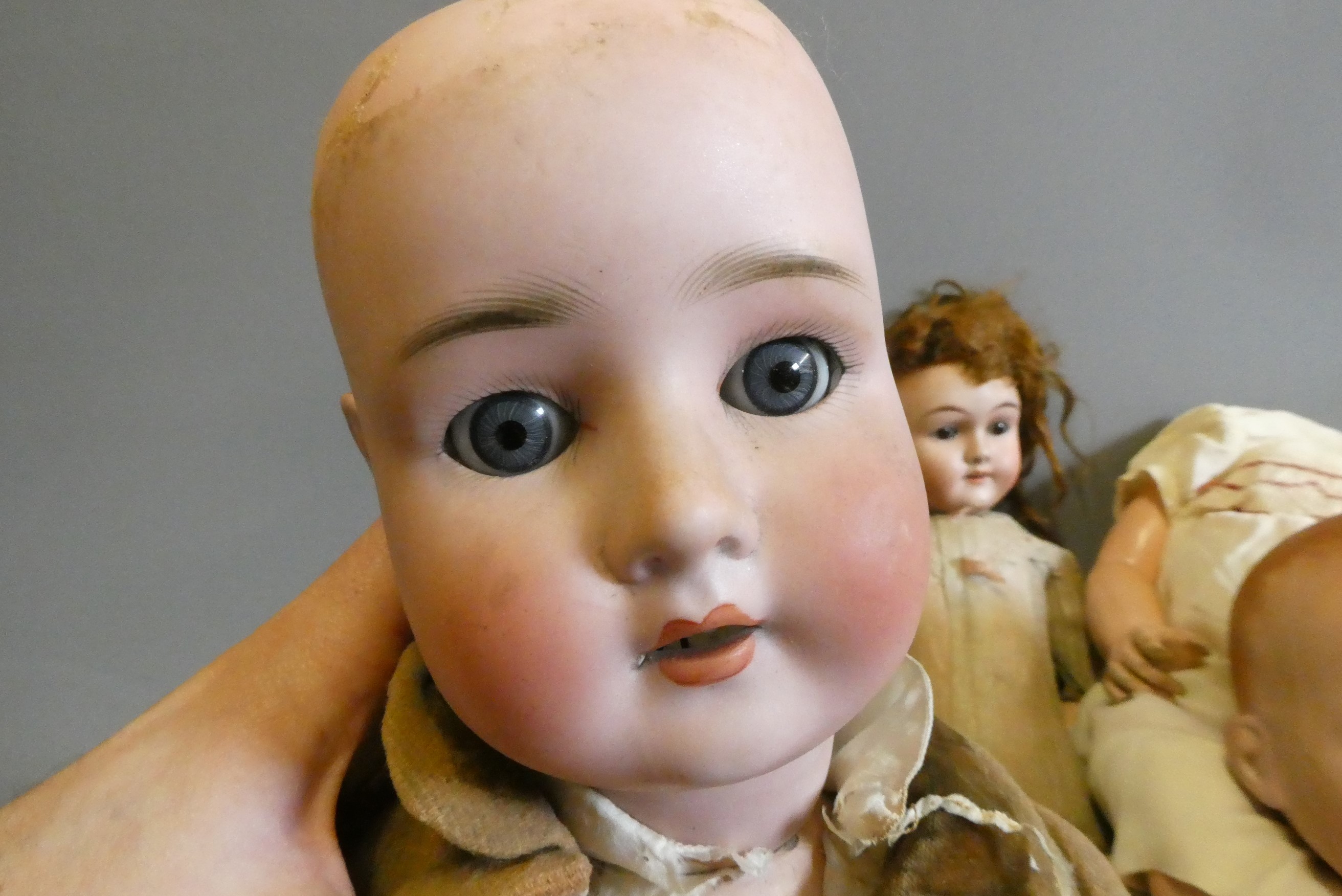 Four bisque socket head dolls Image