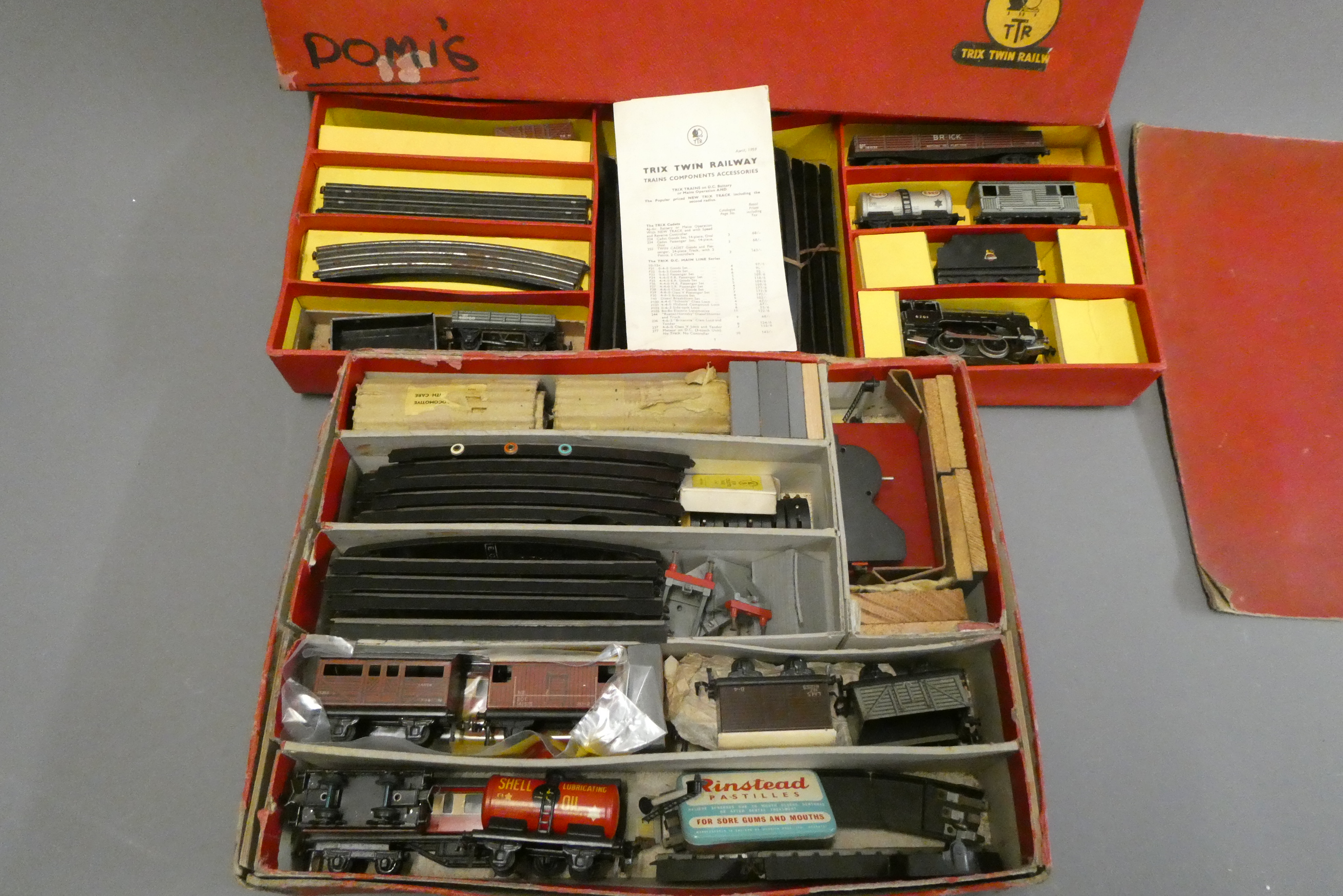 Two trix-twin goods train sets with 0-4-0 tender locomotives, goods ...