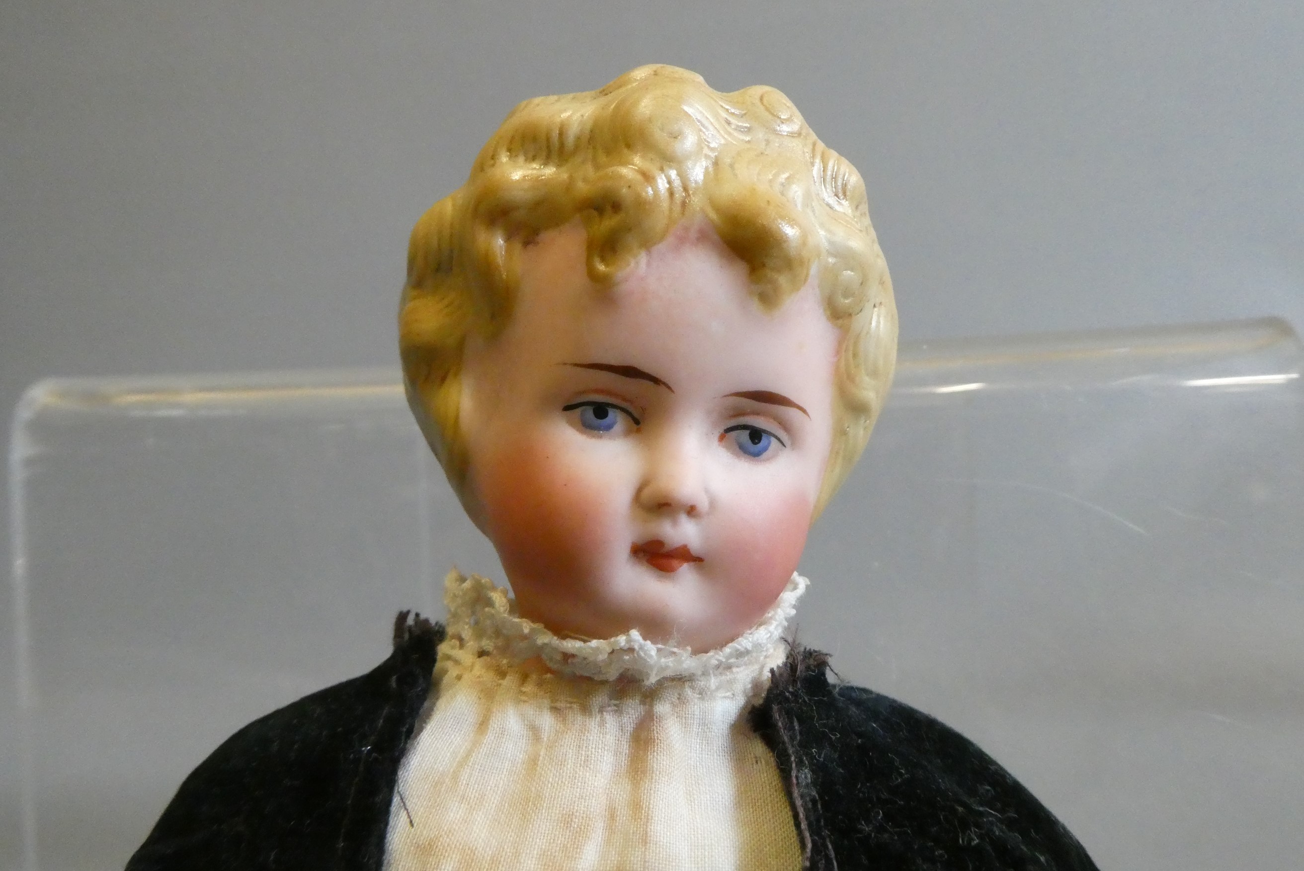 A bisque shoulder head doll, possible Alt, Beck & Gottschalck, with moulded hair, painted features, Image
