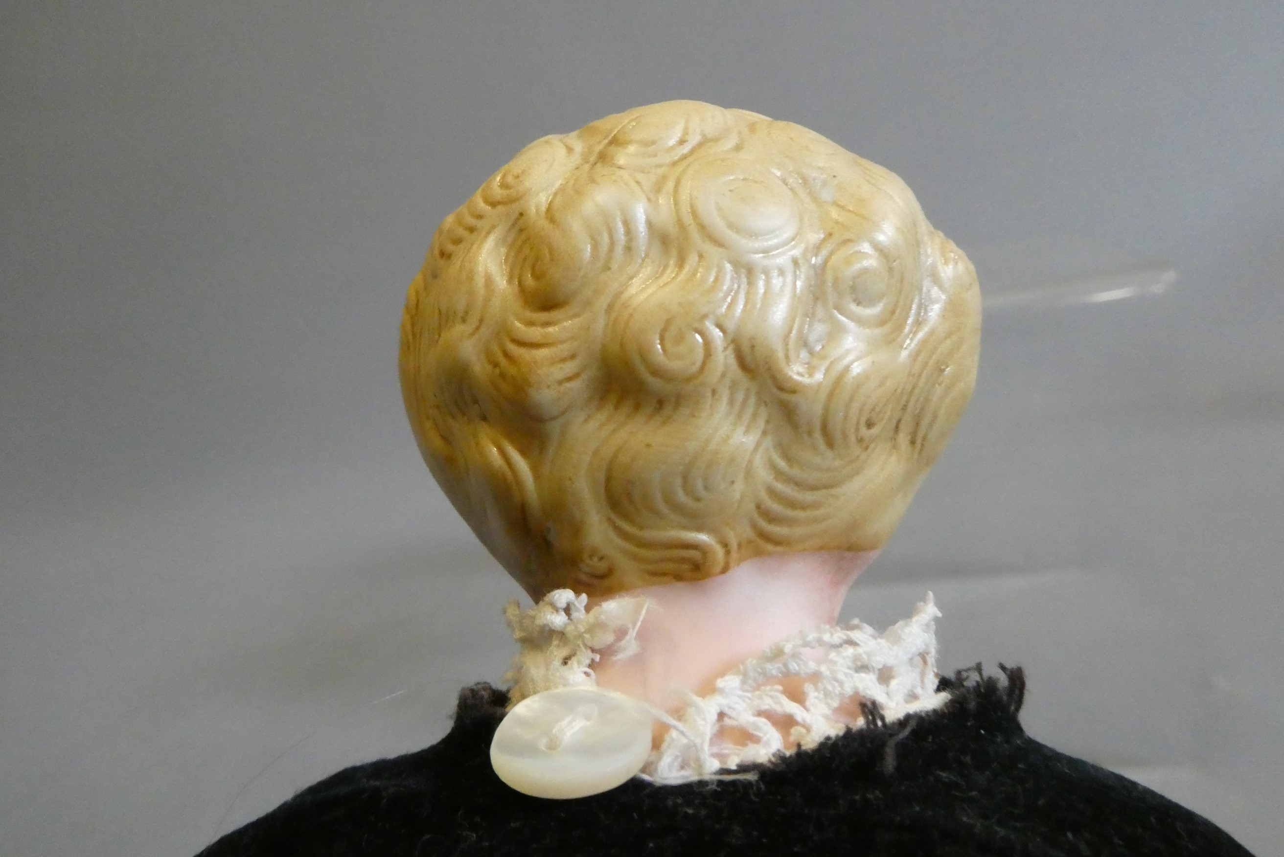 A bisque shoulder head doll, possible Alt, Beck & Gottschalck, with moulded hair, painted features, Image