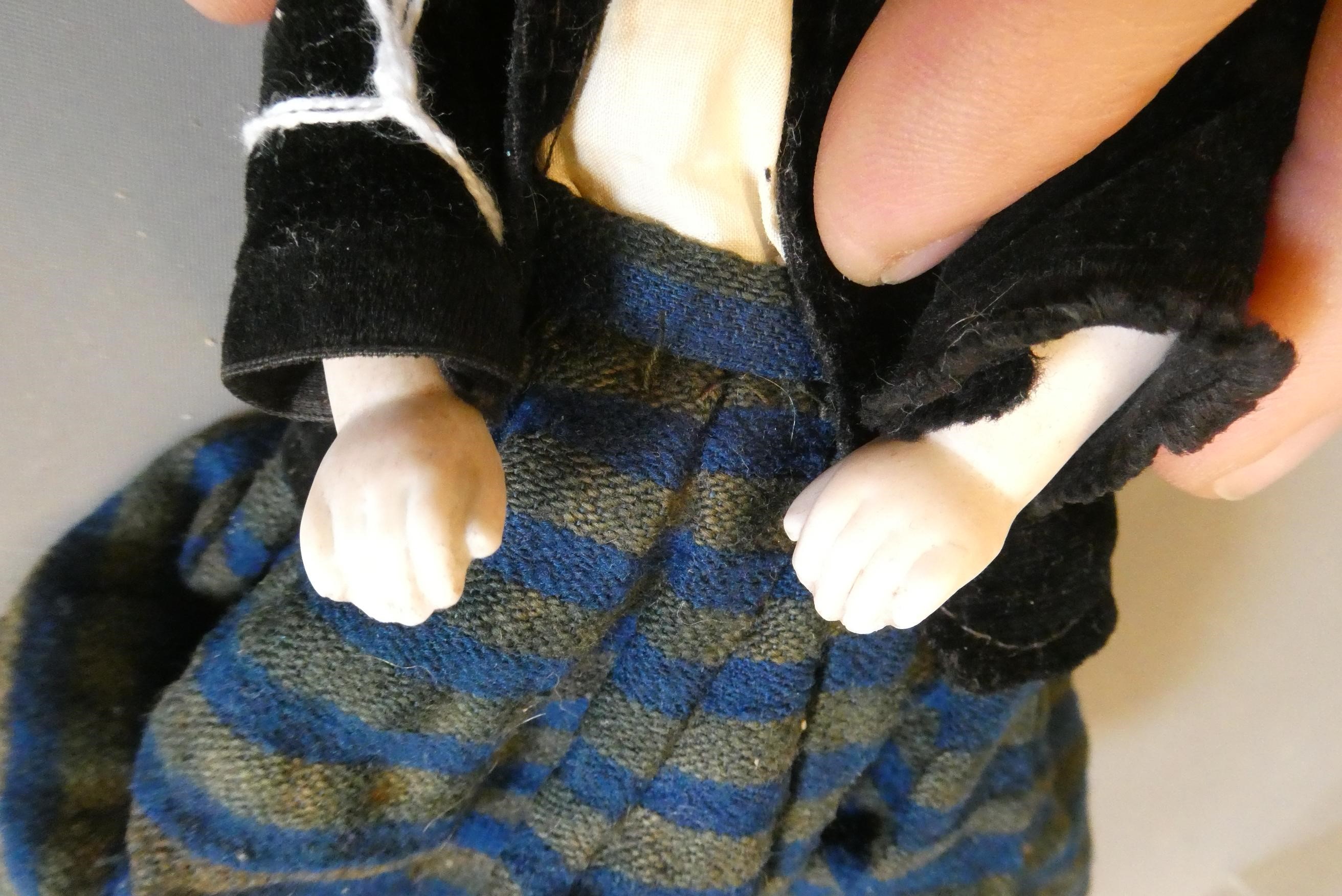 A bisque shoulder head doll, possible Alt, Beck & Gottschalck, with moulded hair, painted features, Image