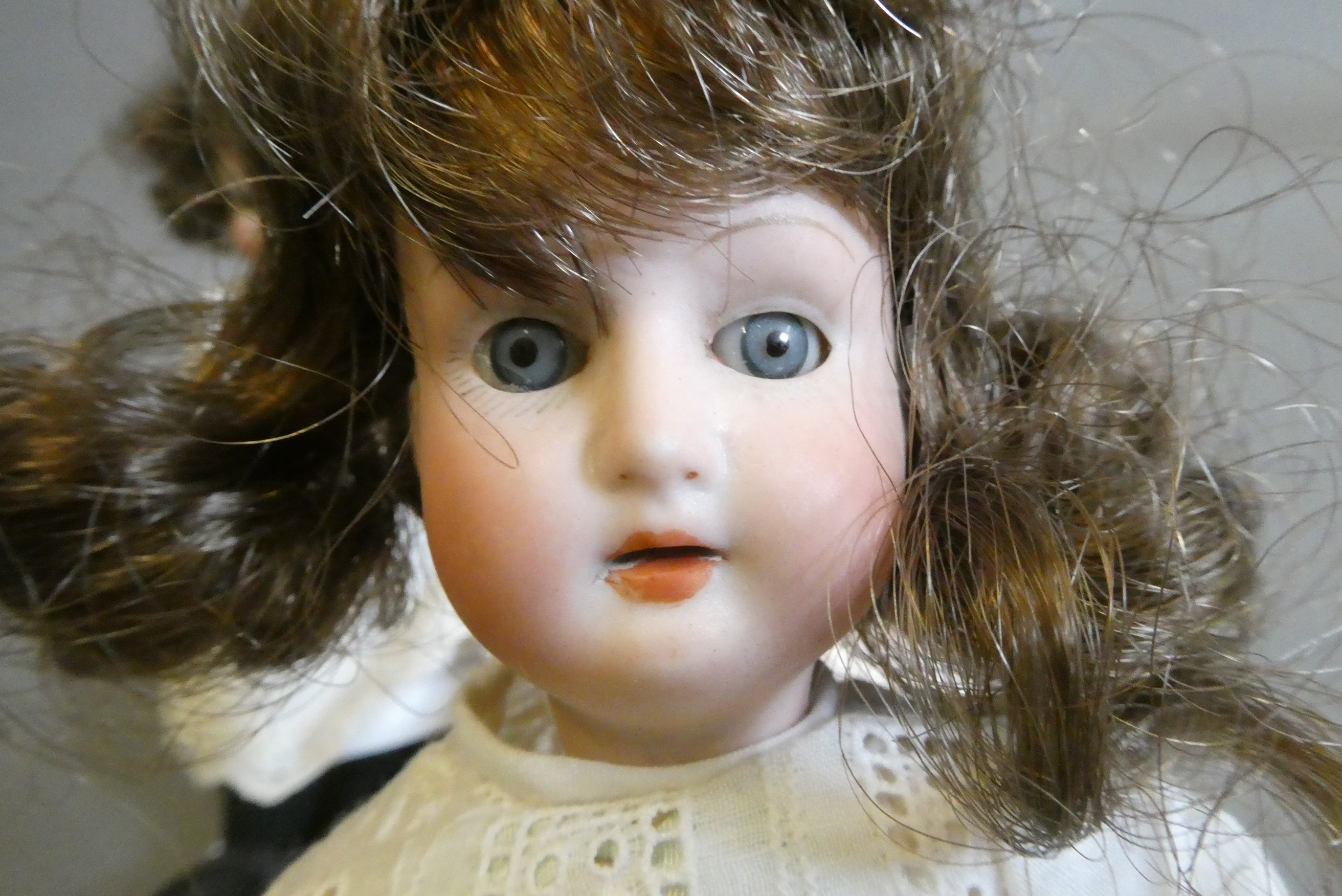Three small bisque socket head dolls Image