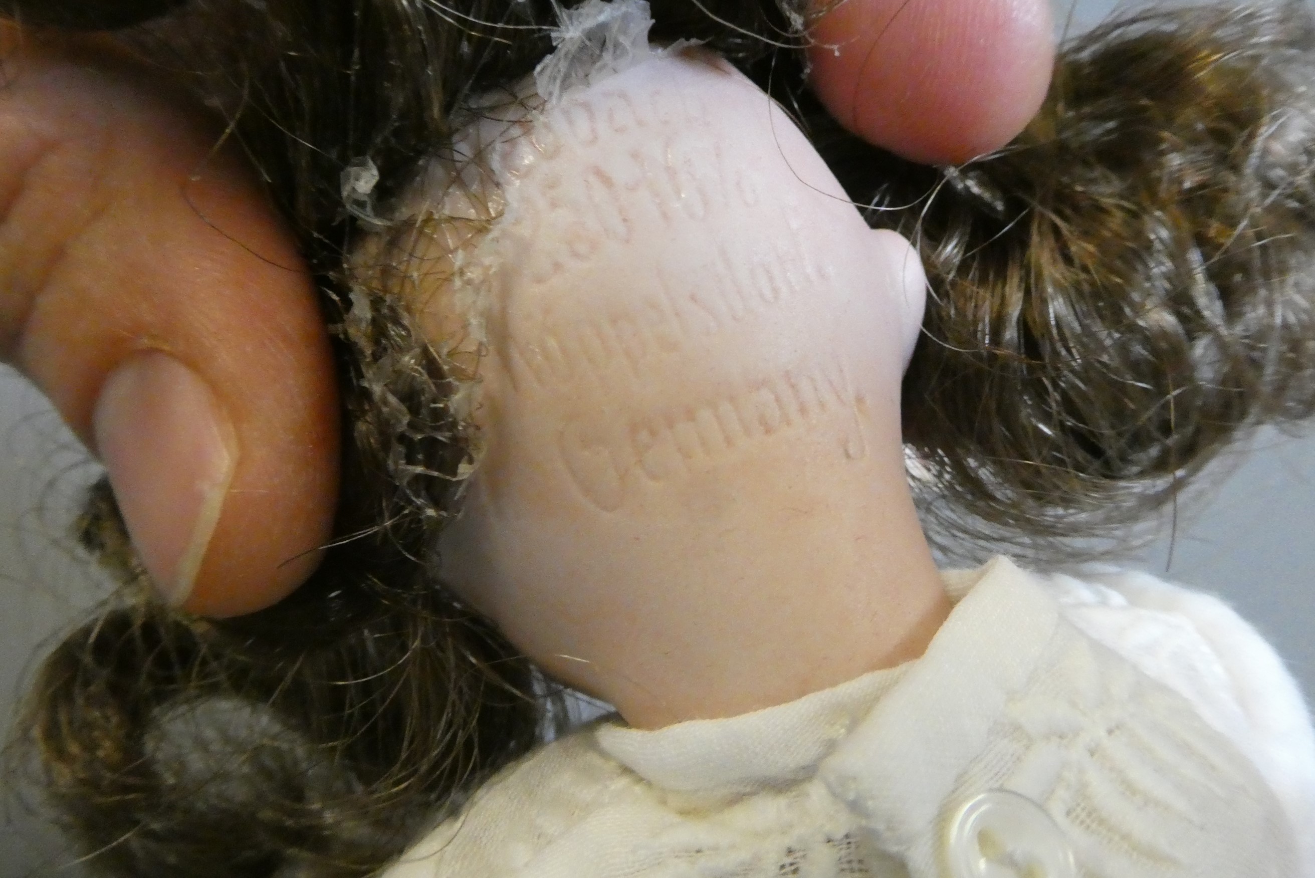Three small bisque socket head dolls Image