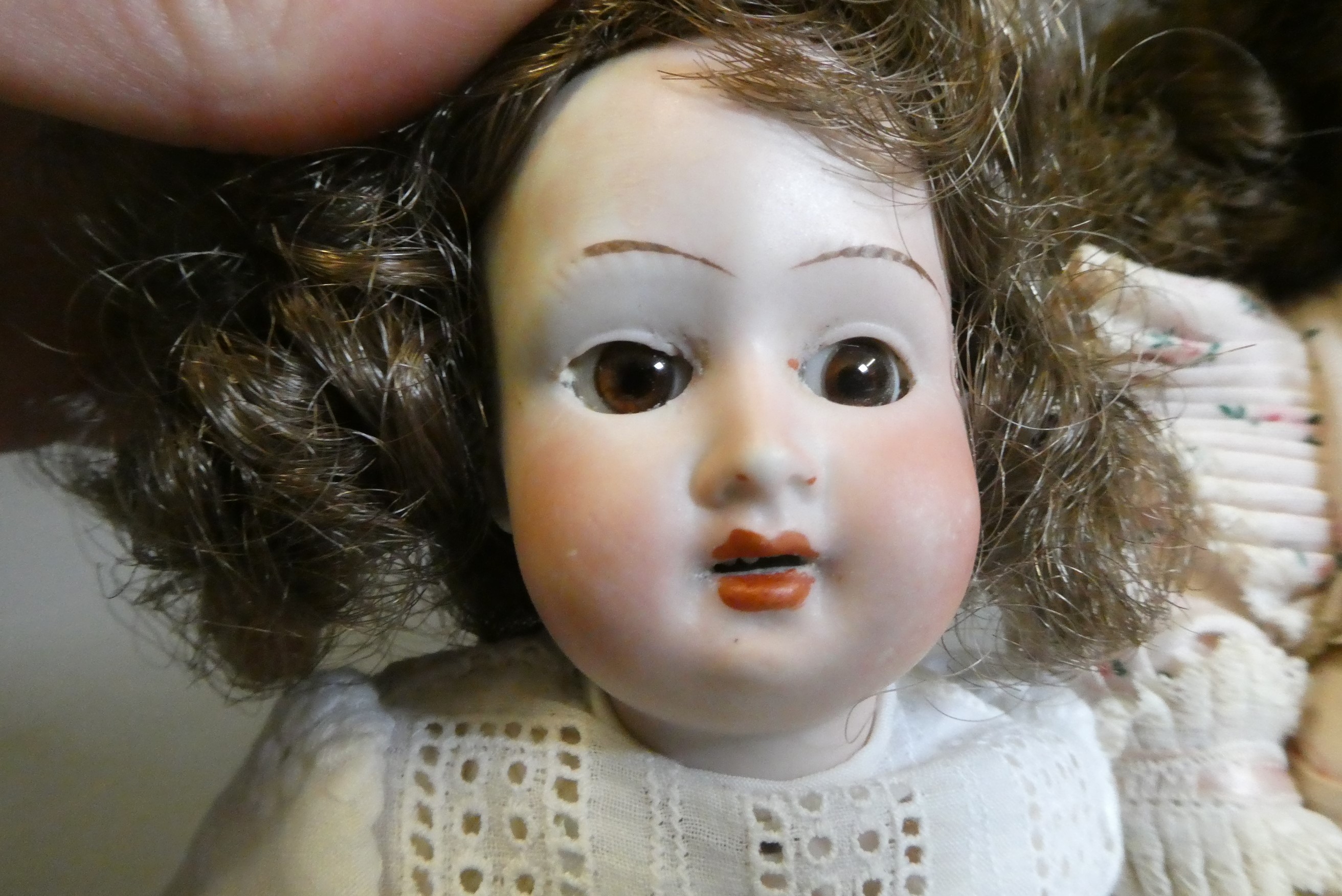 Three small bisque socket head dolls Image