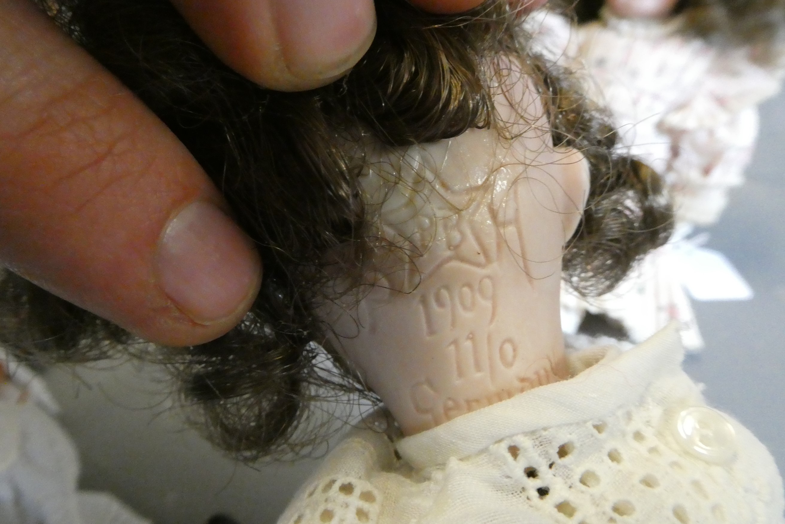Three small bisque socket head dolls Image