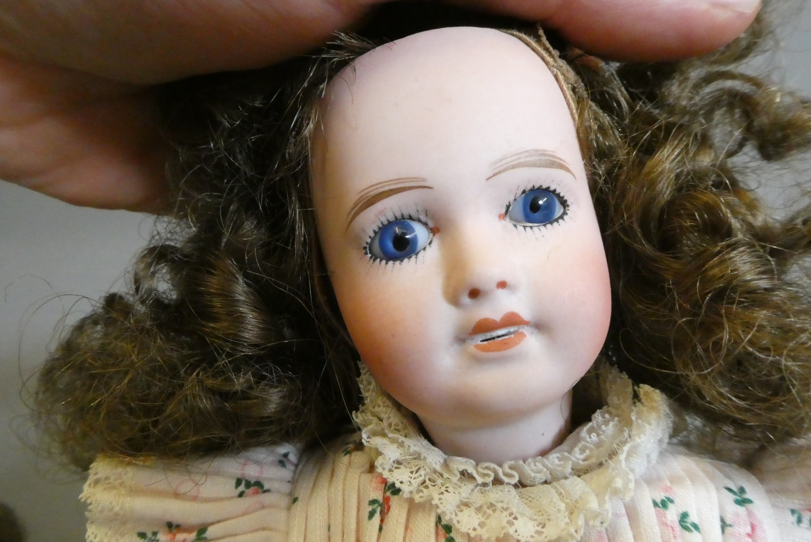 Three small bisque socket head dolls Image
