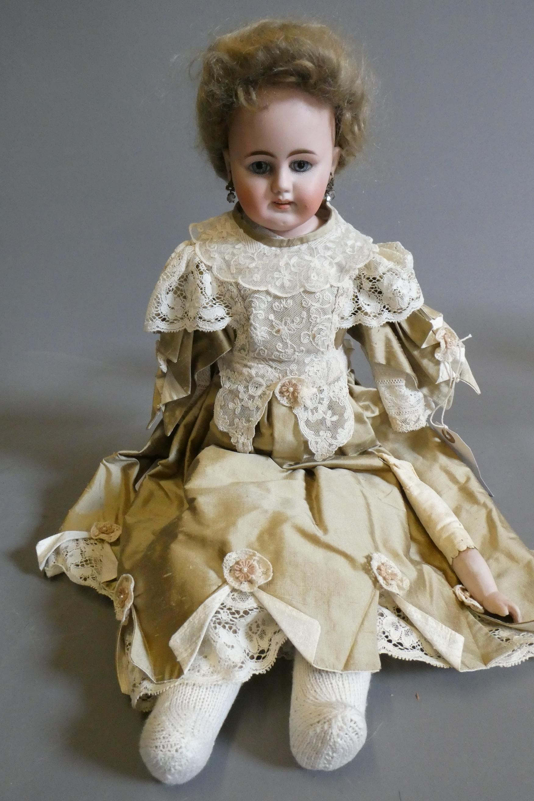 A bisque shoulder head doll, possible Bahr & Proschild, with blue glass fixed eyes, open mouth, Image