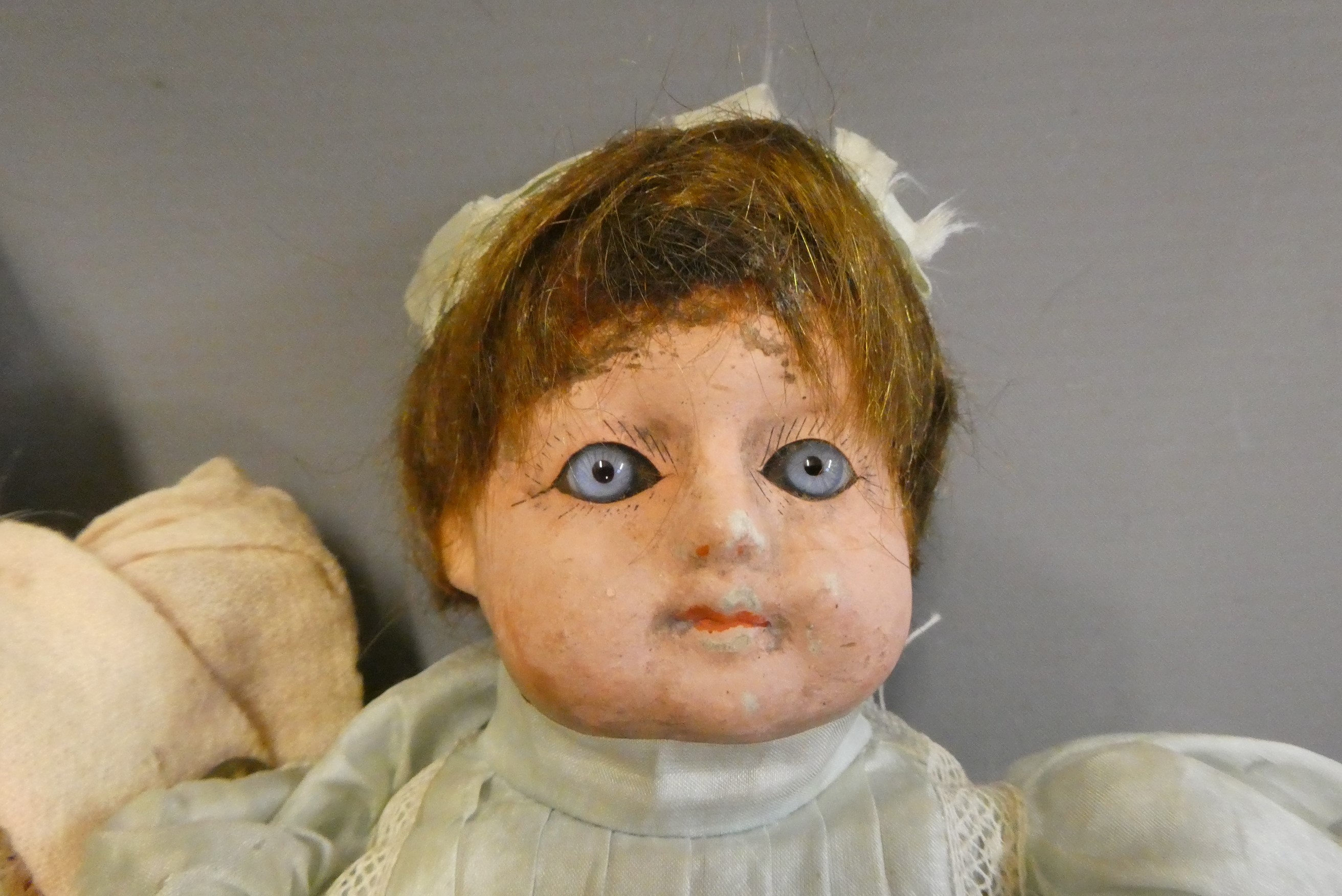 Two early composition dolls, both with glass eyes (one fixed, one sleeping), composition lower limbs Image