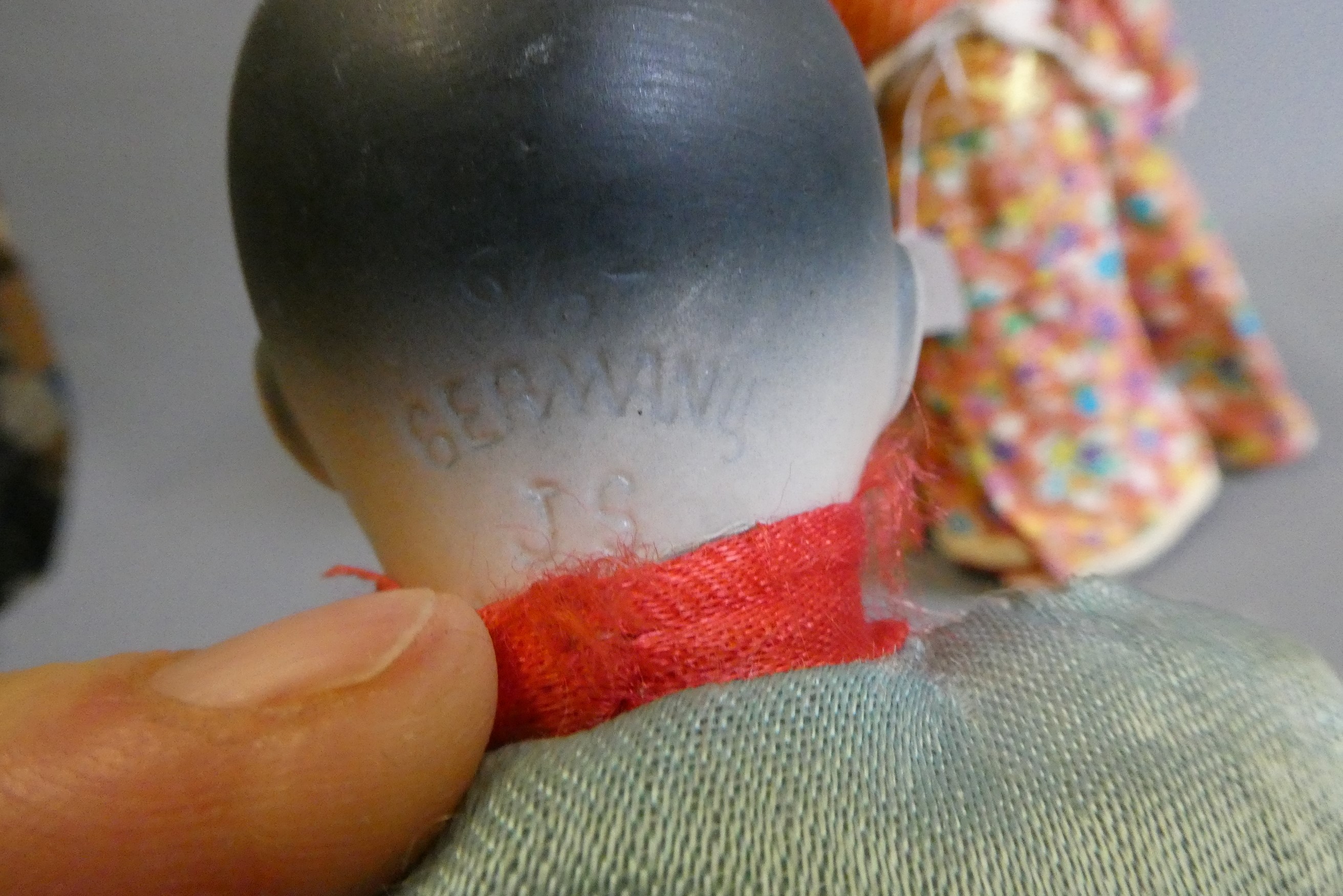 Two oriental dolls comprising an 11" bisque flange neck boy with sleeping eyes Image