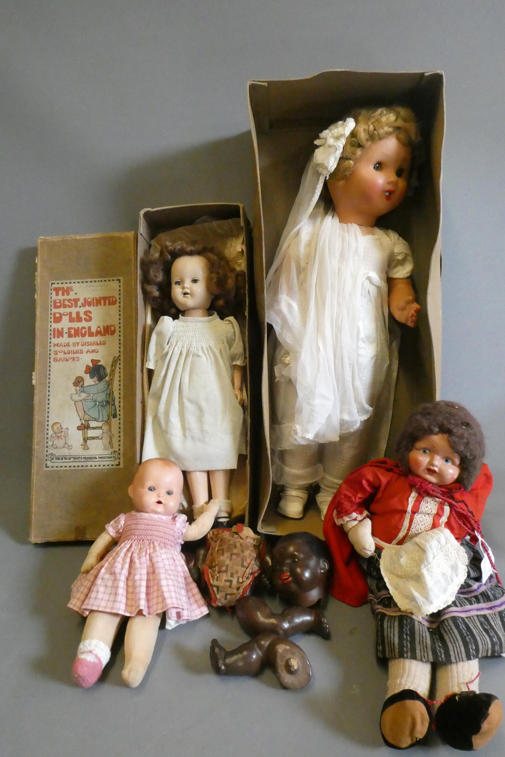 Five vintage dolls, including two in original boxes (one by Lord Roberts Memorial Workshops), an AM Image