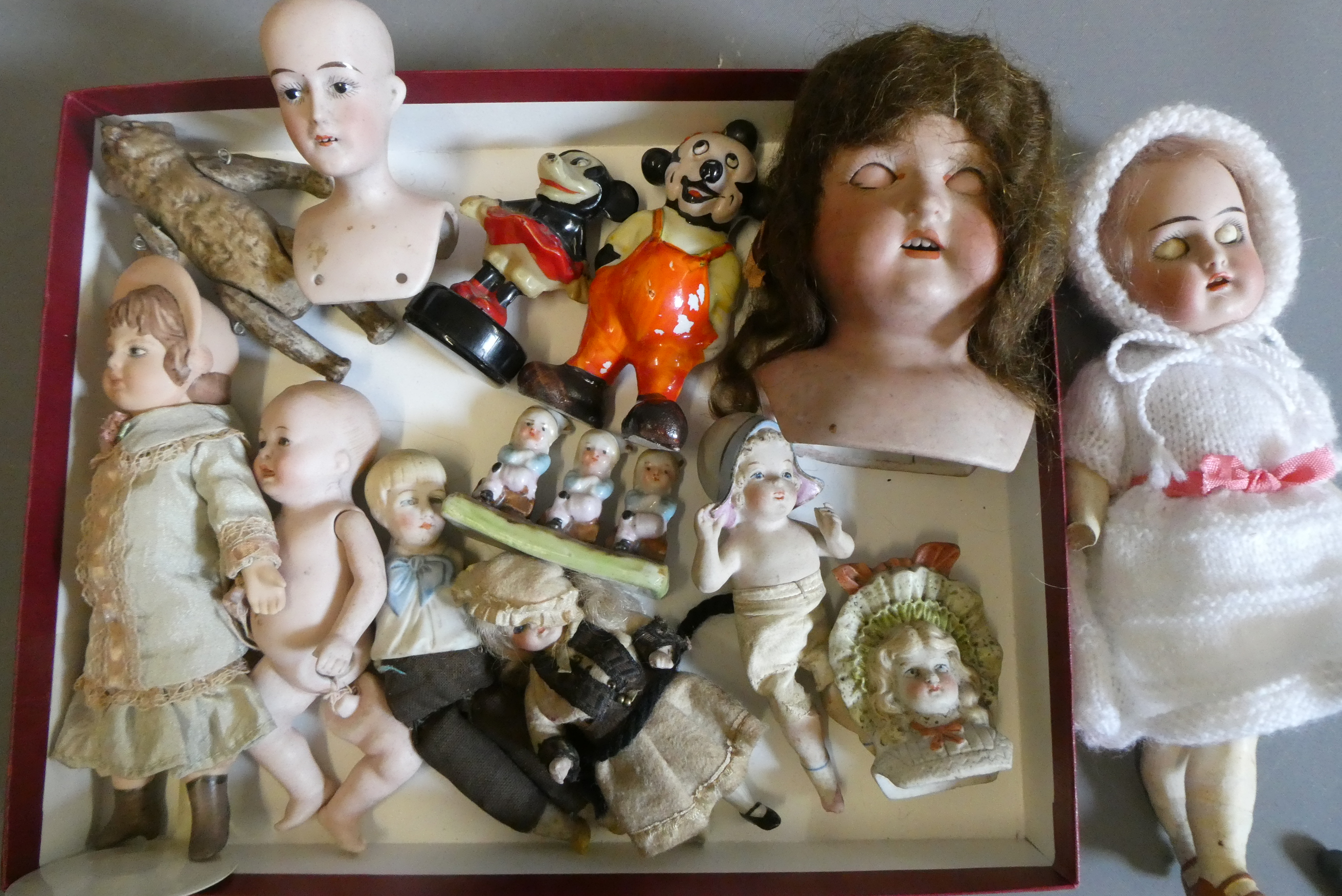 A collection of vintage and antique dolls and toys, including all bisque examples, an all bisque Image