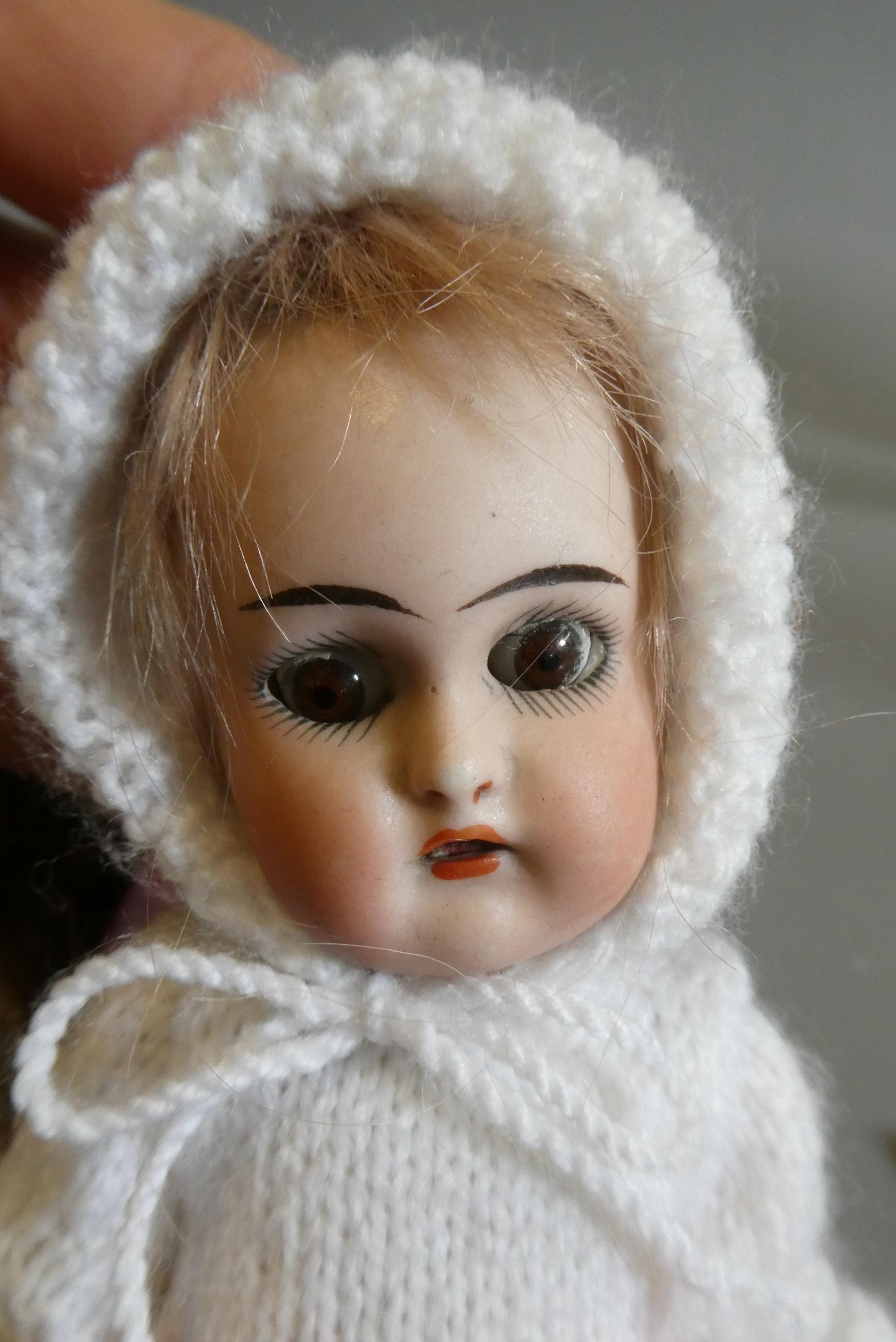 A collection of vintage and antique dolls and toys, including all bisque examples, an all bisque Image