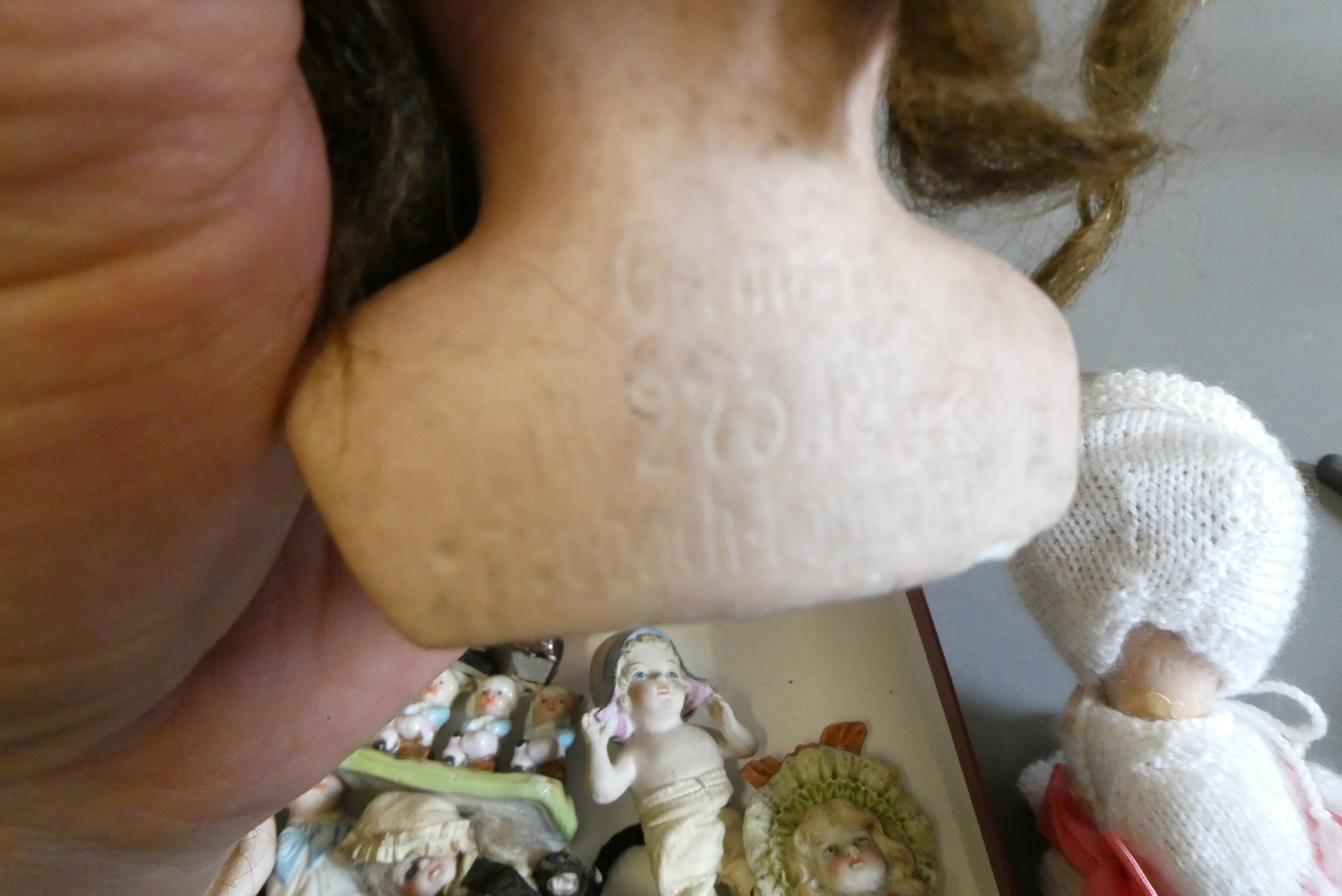 A collection of vintage and antique dolls and toys, including all bisque examples, an all bisque Image