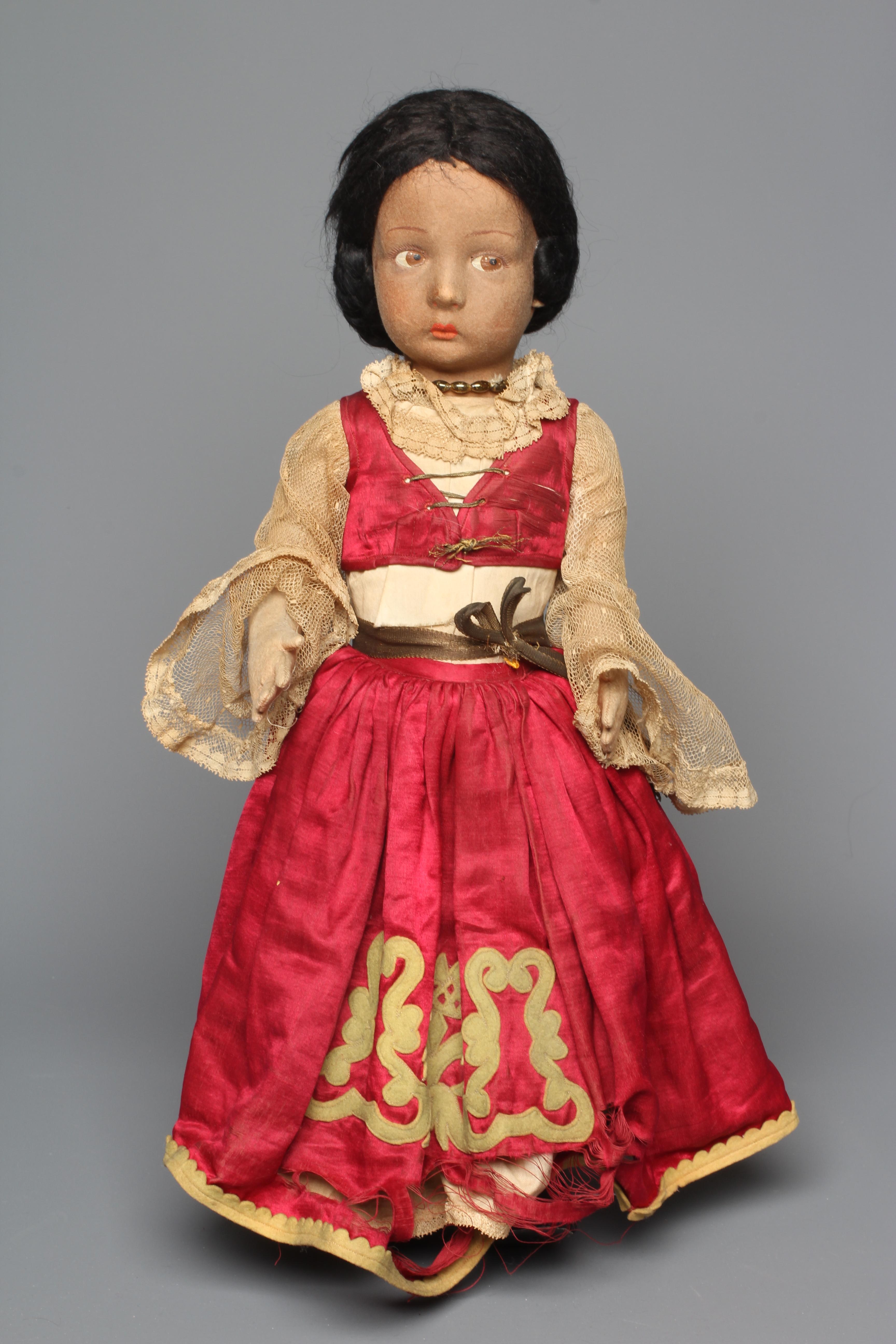 A pre-war Lenci girl doll, with sideways glancing eyes, felt body, bent arms, straight legs and Image