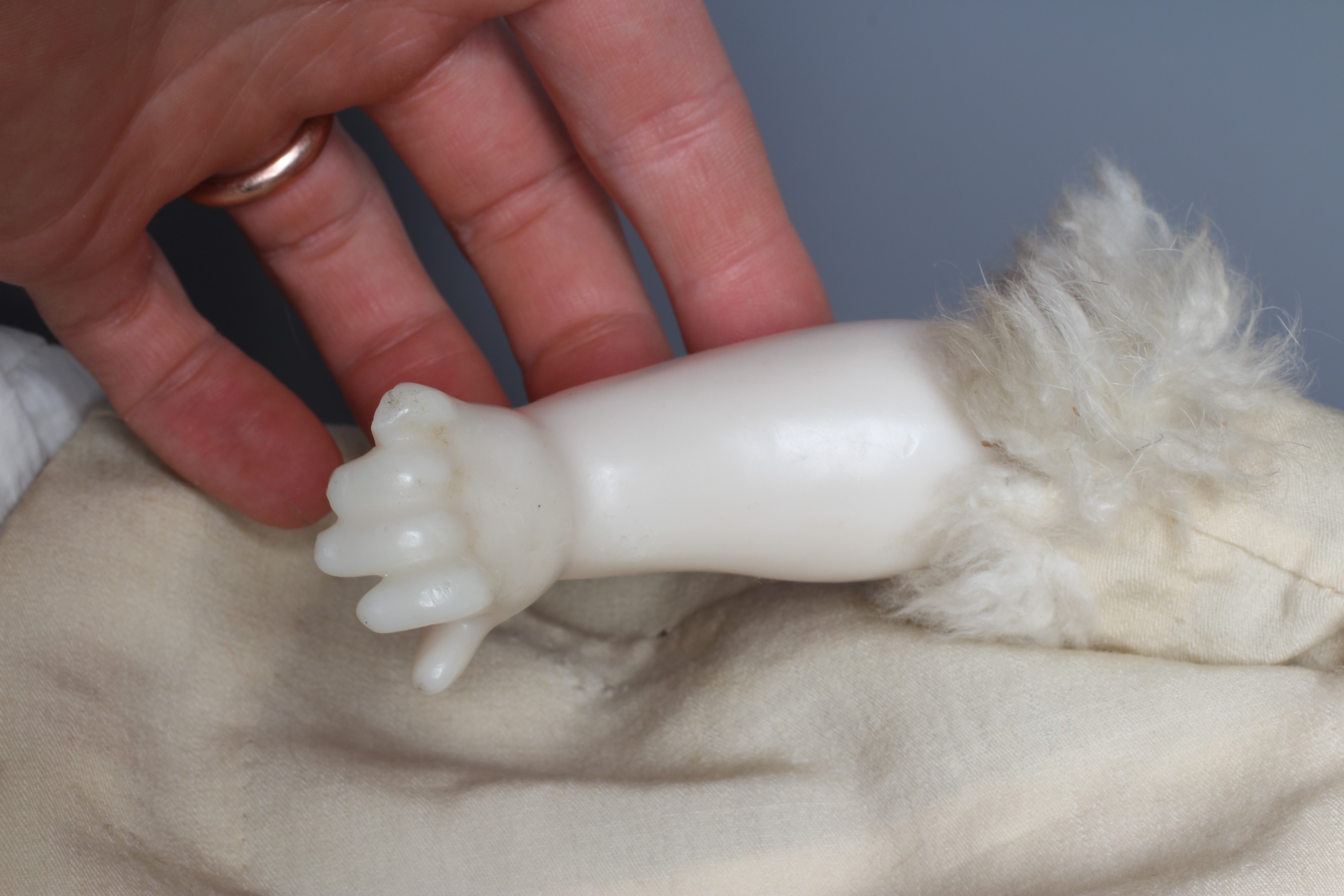 A Victorian poured wax shoulder head doll, with blue glass fixed eyes, closed mouth, blond wig, Image