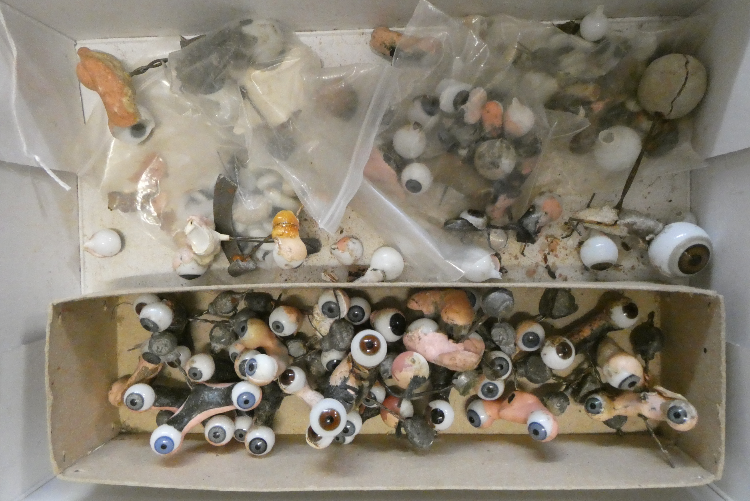 Twenty five pairs of doll's eyes on rockers, and other assorted eyes Image